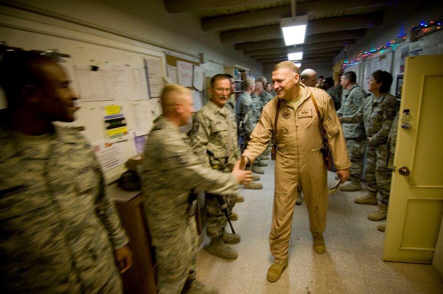 Lt. Gen. Gary North, U.S. Air Forces Central commander, shakes hands with the Airmen of the 755th Expeditionary Civil Engineer Squadron at Bagram Air Field, Afghanistan, Christmas Eve, Dec. 24. The Airmen showed enthusiasm after General North relayed ambitious plans for further construction at Bagram Air Field. (U.S. Air Force photo by Staff Sgt. Samuel Morse)(Released)