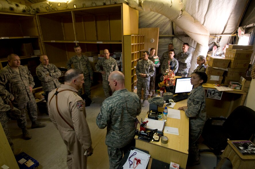 Lt. Gen. Gary North, U.S. Air Forces Central commander, and his travel team visit the Air Force post office at Bagram Air Field, Afghanistan, Christmas Eve, Dec. 24. General North wanted to make sure parcels were reaching the Airmen deployed here during the holiday season. (U.S. Air Force photo by Staff Sgt. Samuel Morse)(Released)