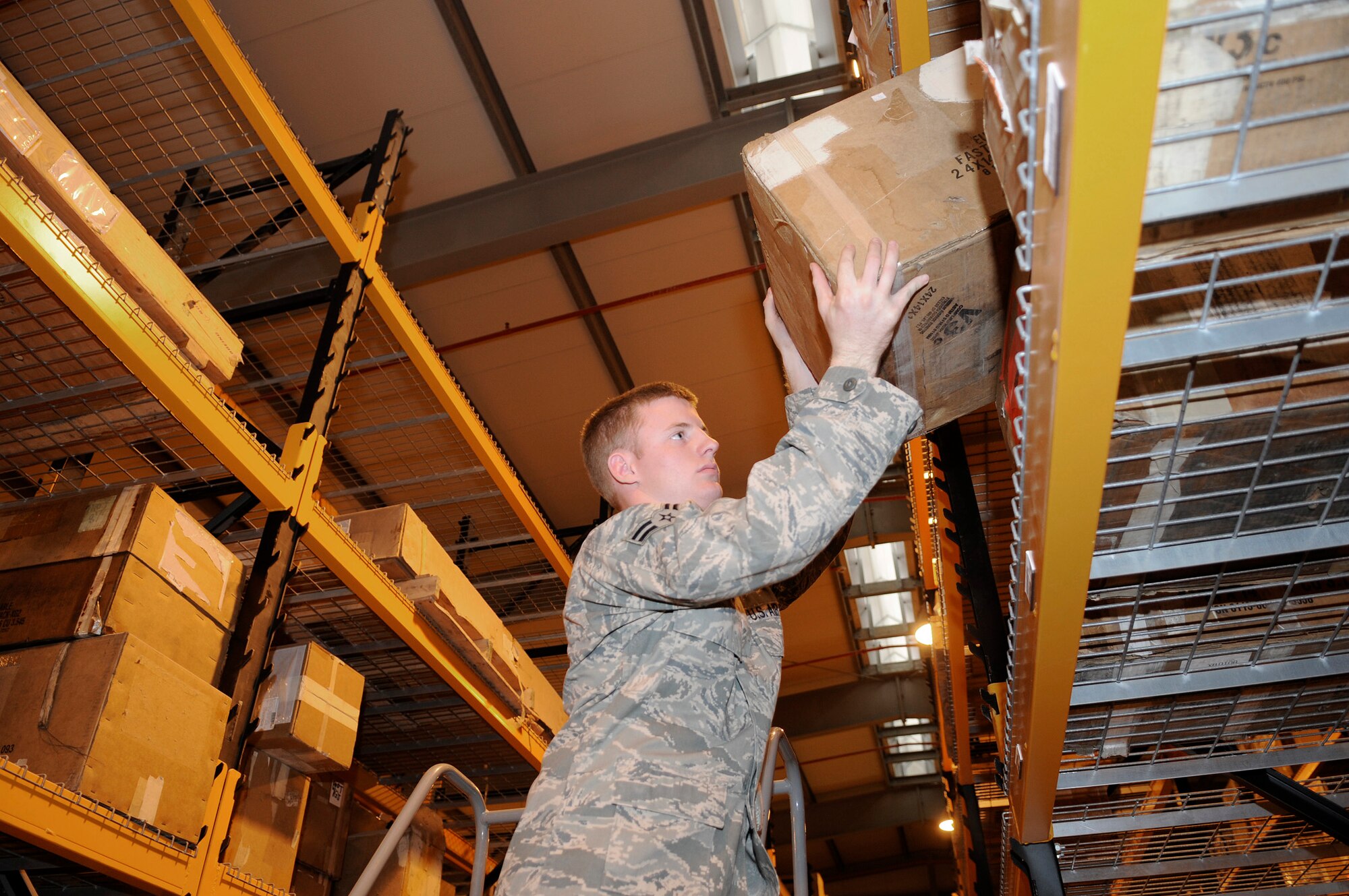 Airman 1st Class Jacob Odom, a supply journeyman assigned to the 379th Expeditionary Logistics Readiness Squadron, uses a stepladder to pull aircraft parts from the higher shelves, Dec. 22, 2008, at an undisclosed air base in Southwest Asia.  The supply team runs the consolidated aircraft parts storage facility, a collocated facility where all maintenance teams can go to pick up the items to fix their specific aircraft.  Airman Odom is a native of Jersey, Ga., and deployed from Mountain Home Air Force Base, Idaho, in support of Operations Iraqi and Enduring Freedom and Joint Task Force-Horn of Africa.  (U.S. Air Force photo by Tech. Sgt. Michael Boquette/Released)