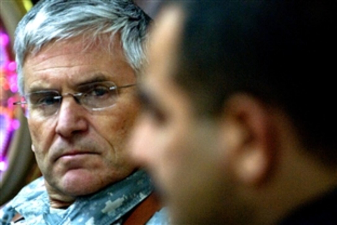 Gen. George Casey, Army chief of staff, listens to Iraqi Police Maj. Gen. Saad Ali Ati, head of the Maysan province's police force, during a meeting at the police headquarters in Amarah, Iraq, Dec. 21, 2008. Casey also visited with American soldiers from 2nd Battalion, 7th Cavalry Regiment, 4th Brigade Combat Team, 1st Cavalry Division, stationed at Forward Operating Base Garry Owen. 
