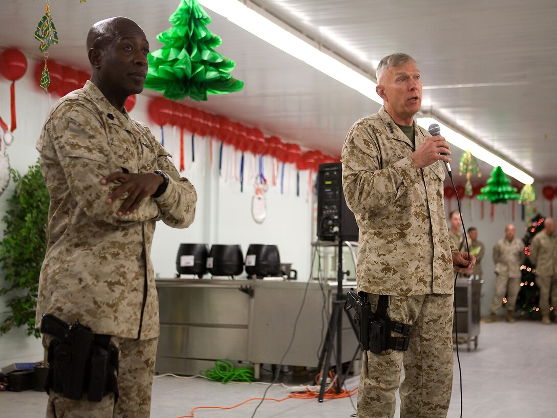 The Commandant, General James Conway, and Sergeant Major, Sgt. Maj. Carlton Kent, of the Marine Corps visited Marines of Task Force 1st Battalion, 3rd Marine Regiment, Regimental Combat Team 1, at Camp Baharia, Karmah, Iraq, December 26. Before they spoke to Marines, everyone present stood at attention as General Conway presented Marines from 2nd Platoon, Company C, 1st Bn., 3rd Marines, Purple Hearts for injuries sustained from an improvised explosive device attack during a patrol in Karmah December 21. They also thanked Marines for their hard work and talked about future operations before answering questions. (Official U.S. Marine Corps Photo / Released)