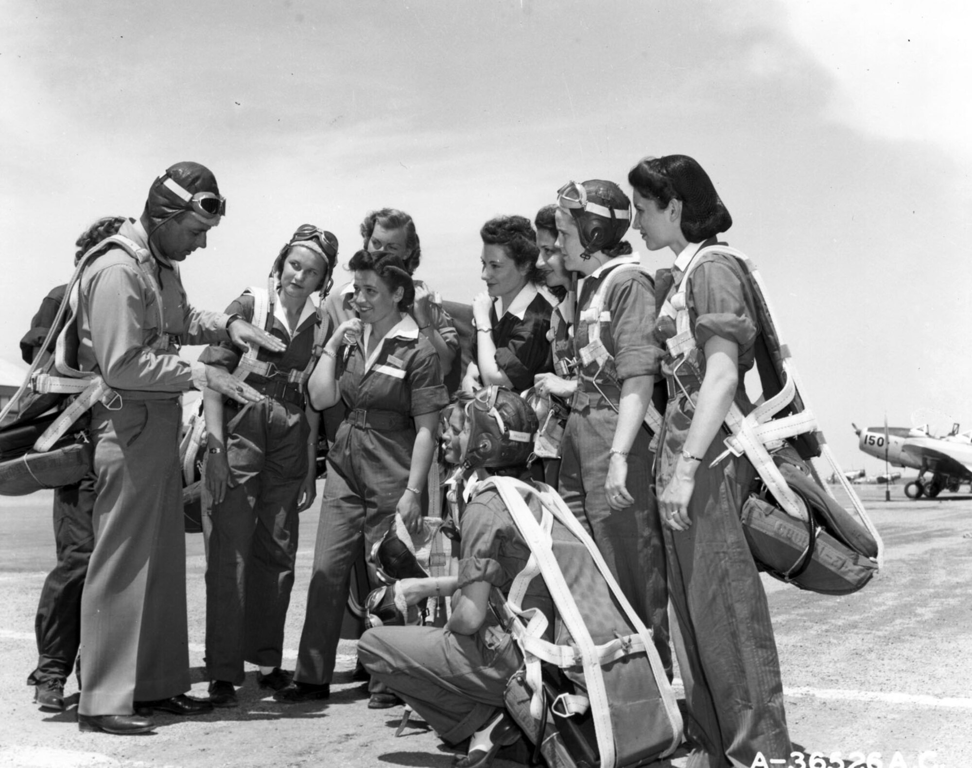 WASP trainees and their instructor pilot. (U.S. Air Force photo)