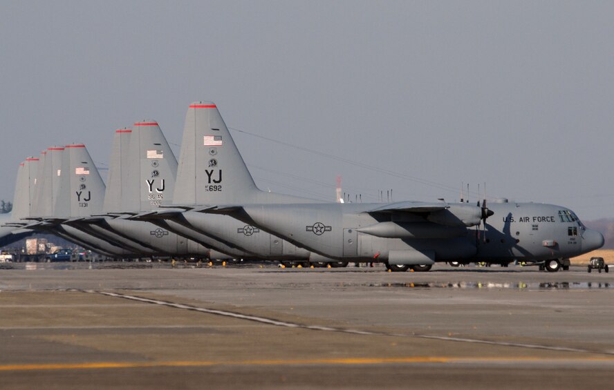 YOKOTA AIR BASE, Japan -- C-130 Hercules aircraft of the 36th Airlift Squadron wait on the flightline Dec. 29 for their next mission. The 36th is the only forward-based tactical airlift squadron in the Pacific. The squadron conducts theater airlift, special operations, aeromedical evacuation, search and rescue, repatriation and humanitarian relief missions. (U.S. Air Force photo by Senior Airman Brian Kimball)