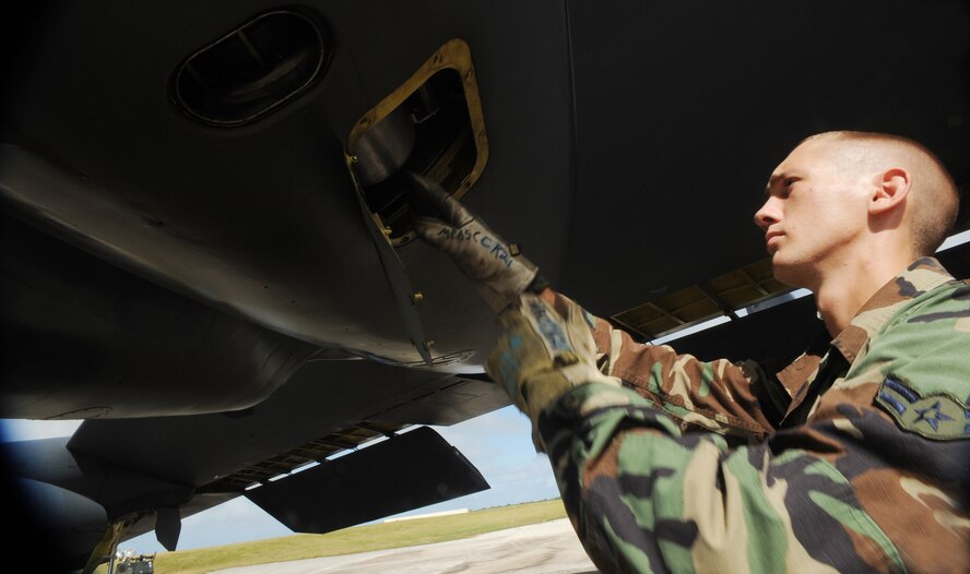 Airman 1st Class Michael Brand, crew chief 36th Expeditionary Aircraft Maintenance Squadron loads a ?quick start? cartridge on a B-52 Stratofortress prior to a local training mission Dec. 30 at Andersen Air Force Base, Guam. Throughout the month of December, Deployed Minot Airmen have been launching aircraft by a method known as cartridge starts, or ?Cart-Starts.?  During these launches, a small controlled explosive is inserted into two of the eight engines located on the B-52 providing a rapid response launch capability.  Airman Brand is deployed from Minot AFB, N.D. 
(U.S. Air Force photo/ Master Sgt. Kevin J. Gruenwald) released





















  












 












































  












 

























