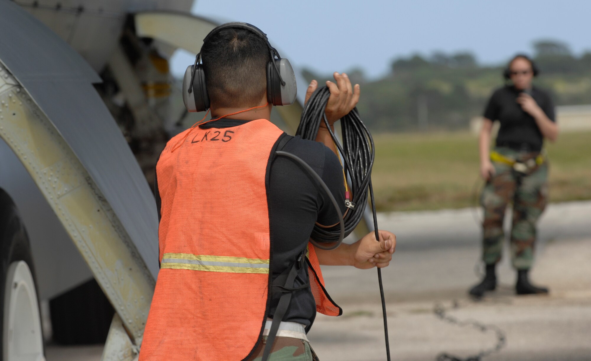 (foreground) Tech. Sgt. Carlos Sanchez wraps up a communication cord Dec. 30, while Airman 1st Class Caroline Kraus, checks in with aircrew during a B-52 Stratofortress launch at Andersen Air Force Base, Guam. Both are assigned to the 36th Expeditionary Aircraft Maintenance Squadron at Andersen and are deployed from Minot AFB, N.D. The bomber's participation in constant training helps emphasize the U.S. bomber presence, demonstrating U.S. commitment to the Pacific region.
(U.S. Air Force photo/ Master Sgt. Kevin J. Gruenwald) released





















  












 












































  












 

























