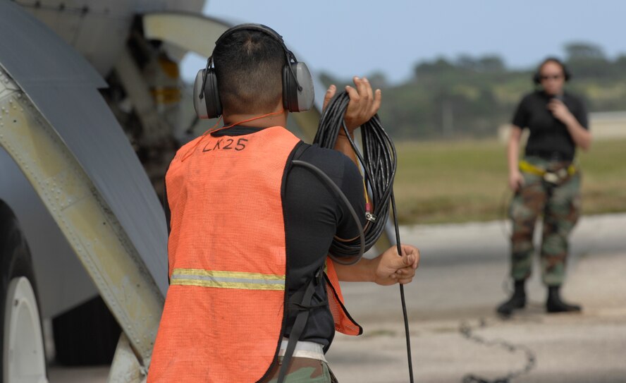 (foreground) Tech. Sgt. Carlos Sanchez wraps up a communication cord Dec. 30, while Airman 1st Class Caroline Kraus, checks in with aircrew during a B-52 Stratofortress launch at Andersen Air Force Base, Guam. Both are assigned to the 36th Expeditionary Aircraft Maintenance Squadron at Andersen and are deployed from Minot AFB, N.D. The bomber's participation in constant training helps emphasize the U.S. bomber presence, demonstrating U.S. commitment to the Pacific region.
(U.S. Air Force photo/ Master Sgt. Kevin J. Gruenwald) released





















  












 












































  












 

























