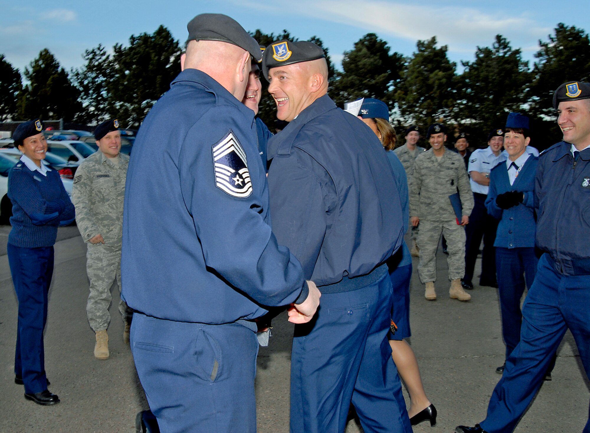 Newly-promoted Master Sgt. Robert J. Cawley celebrates with coworkers after being presented with Master Sgt. stripes through the Stripes for Exceptional Performers. (U.S. Air Force photo/Roberta McDonald) 
