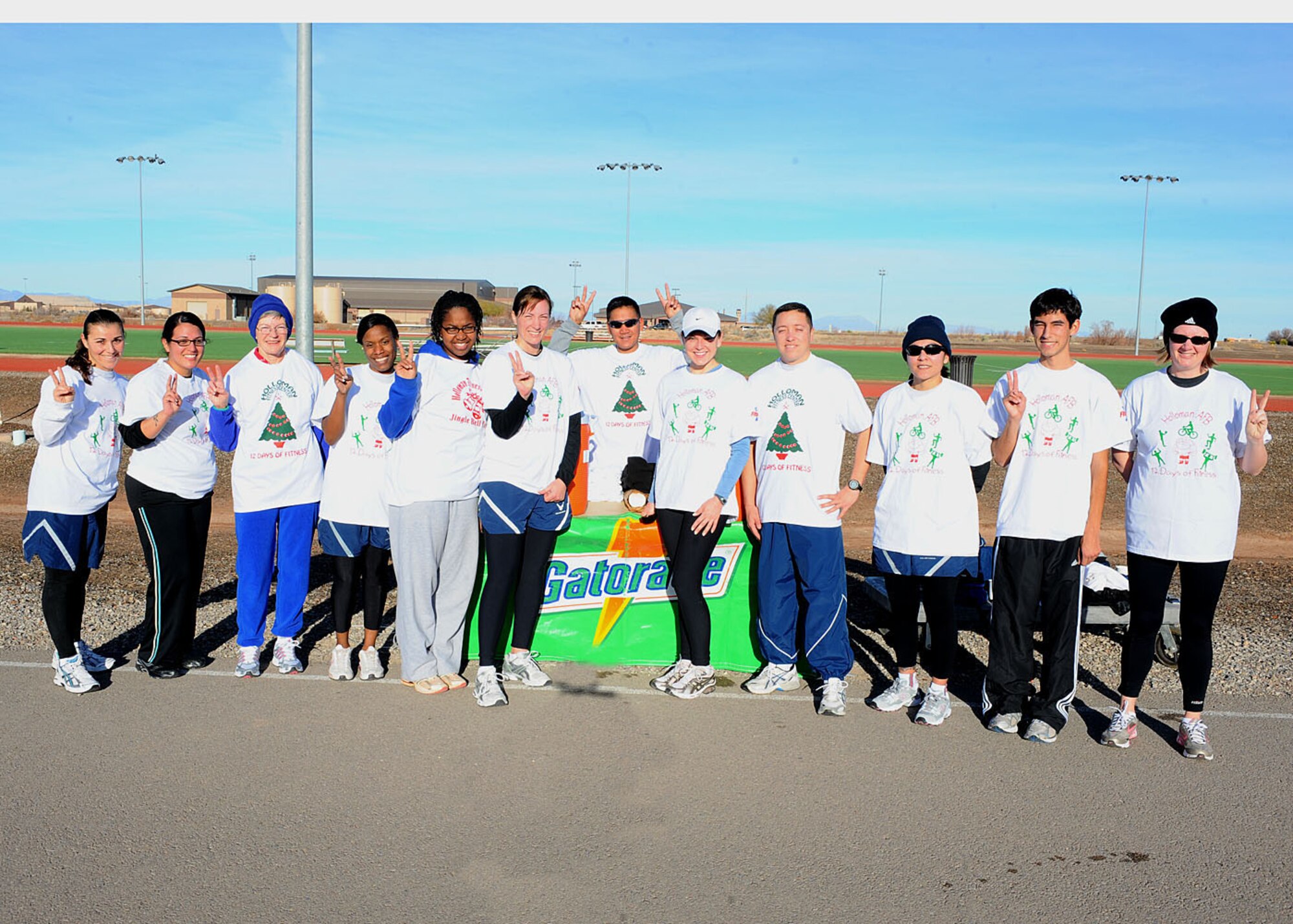 Participants in the Holloman Air Force Base, N.M., Frosty 5k run pose for a group picture at the Fitness and Sports Center track Dec. 19. The Frosty 5k run was the 12th and last run of 2008. (U.S Air Force photo/ Airman 1st Class DeAndre Curtiss)