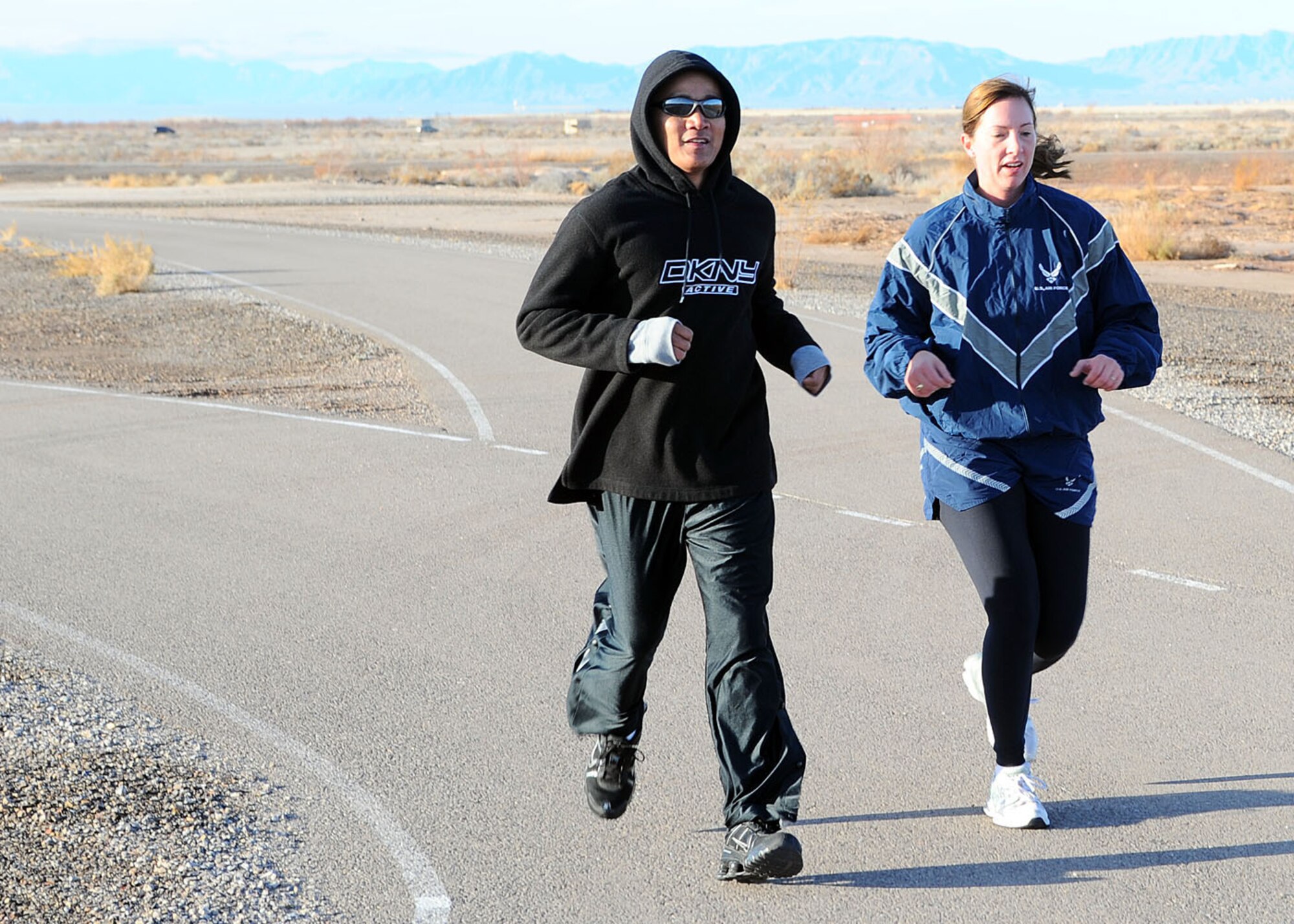 Participants in the Holloman Air Force Base, N.M., Frosty 5k run round out their last lap around the track at the Fitness and Sports Center Dec. 19. The Frosty 5k run was the 12th and last run of 2008. (U.S Air Force photo/ Airman 1st Class DeAndre Curtiss)