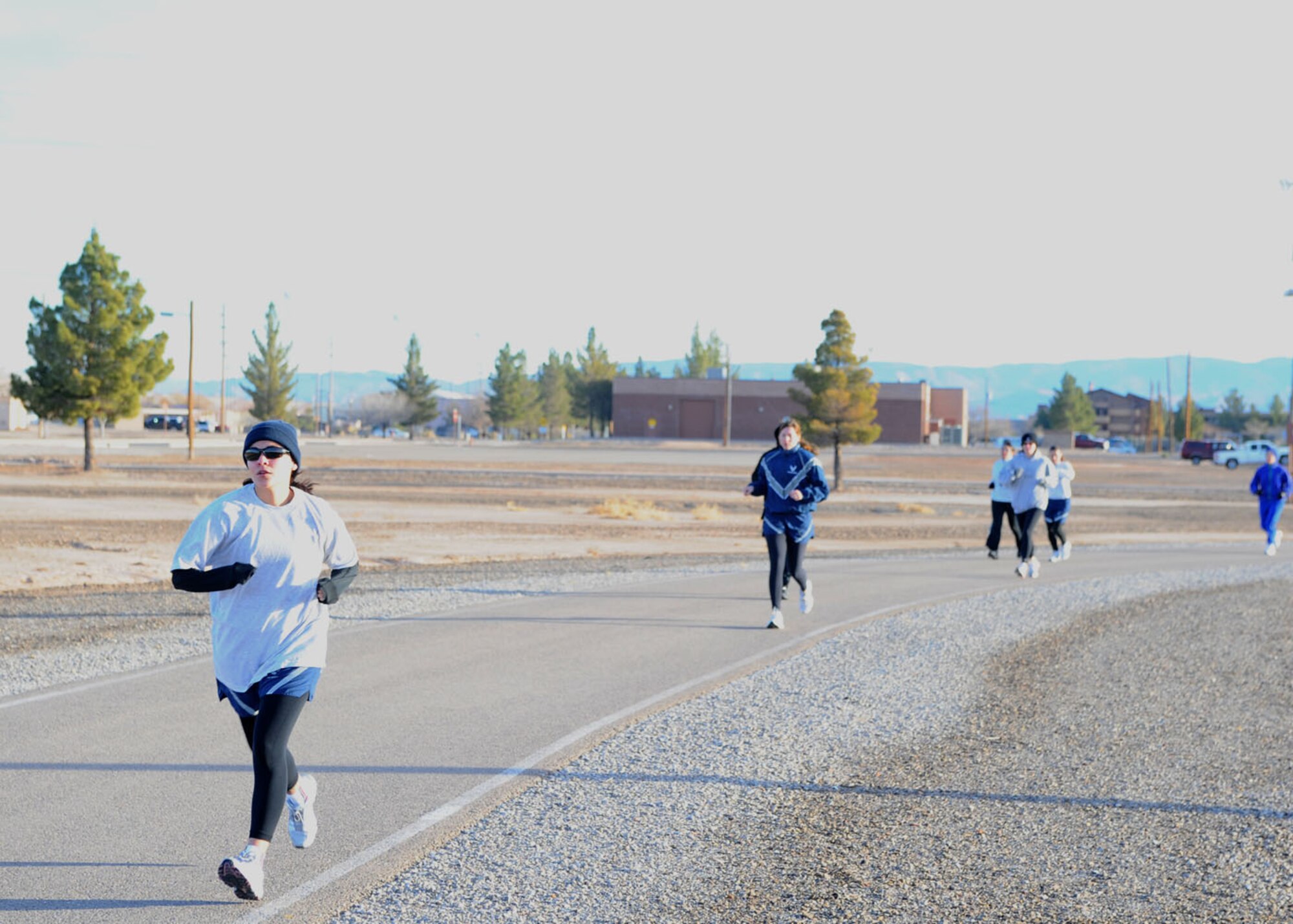 Participants in the Holloman Air Force Base, N.M., Frosty 5k run their first lap of three around the track at the Fitness and Sports Center Dec. 19. All of the participants completed the event in 31 minutes. (U.S Air Force photo/ Airman 1st Class DeAndre Curtiss