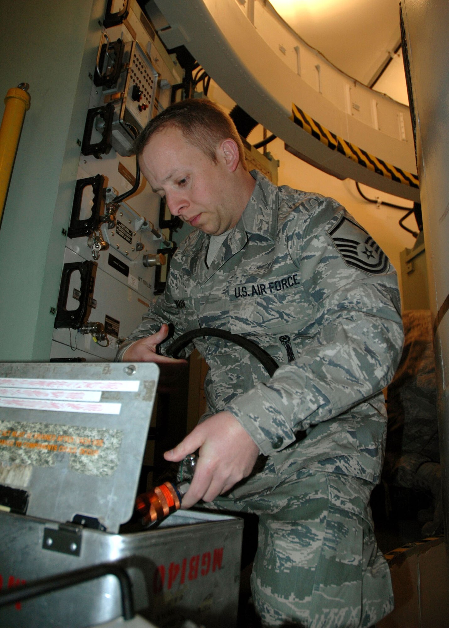 Master Sgt. Max Newman, 341st Maintenance Operations Squadron Team Training Section student, puts away a missile guidance section liquid cooler test set at the T-41 Trainer Dec. 22. The electromechanical team class used the equipment to test coolant temperature, line pressure and flow rate of a missile guidance section liquid cooler, which maintains proper missile guidance computer temperature. Sergeant Newman recently arrived from Vandenberg Air Force Base, Calif., where he taught the cruise missile verification, checkout and equipment course at the 532nd Training Squadron. He will supervise EMT Airmen after graduation. (U.S. Air Force photo/Senior Airman Dillon White)