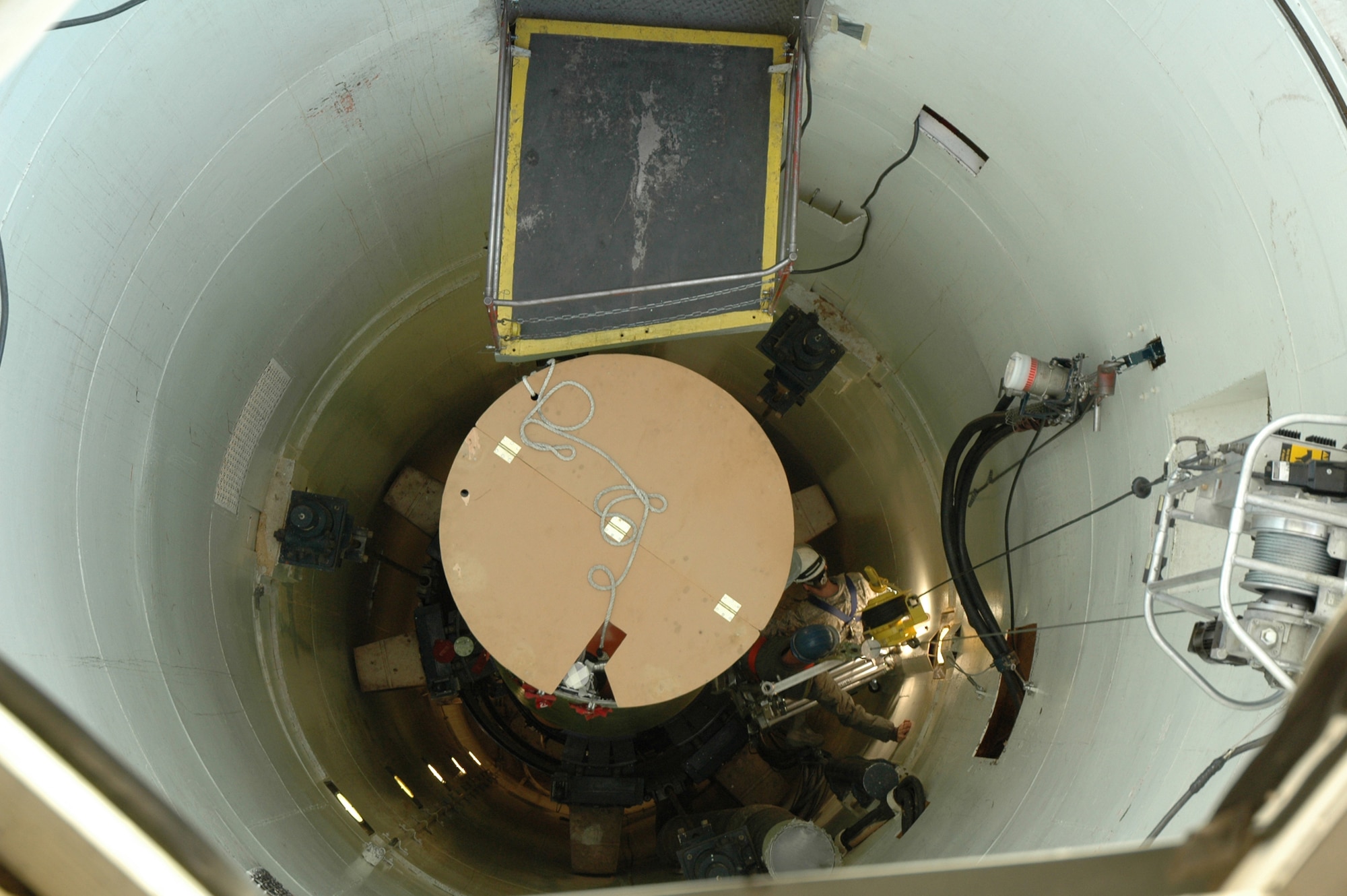 A cage technician in training and an instructor, from the 341st Maintenance Operations Squadron Team Training Section, complete tasks necessary to “safe” an inert Minuteman III at the T-9 Trainer Dec. 16. Airmen must graduate team training before being assigned to the 341st Missile Maintenance Squadron as part of a missile maintenance team. (U.S. Air Force photo/Senior Airman Dillon White)