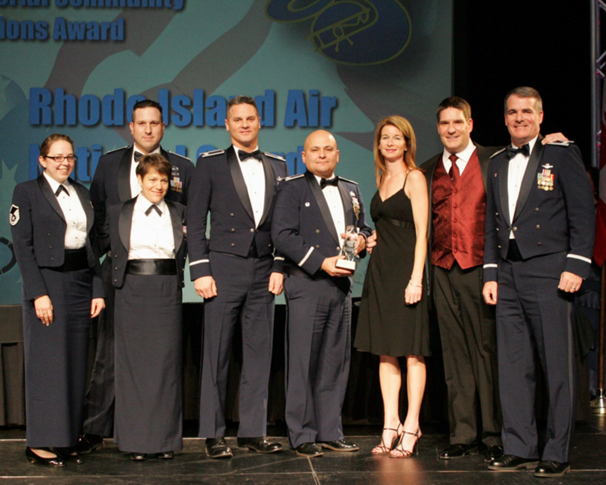 Members of the Rhode Island National Guard Open House and Air Show key staff with founding sponsor Mr. Al Cerrone and his friend Rita pose for a picture at the International Council of Air Shows Conference Chairman's Banquet in Las Vegas, Nevada. The RING Open House and Air Show was presented with the prestigious Dick Schram Community Service award. The RING Open House and Air Show is only one of 3 shows that have won this award twice. They were previously presented the award in 1995. (Released)