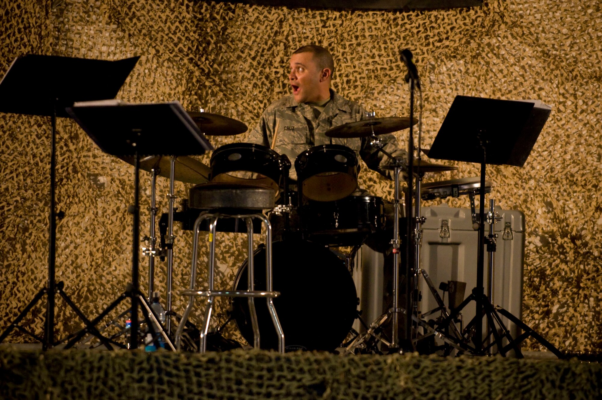 Senior Airman Wilfredo Cruz, drummer for Air Forces Central band "Mojave," starts his drum solo at Bagram Air Field, Afghanistan, Dec. 27. Airman Cruz, a native of Bayamon, Puerto Rico, toured professionally as a civilian for twenty years before joining the Air Force. (U.S. Air Force photo by Staff Sgt. Samuel Morse)(Released)