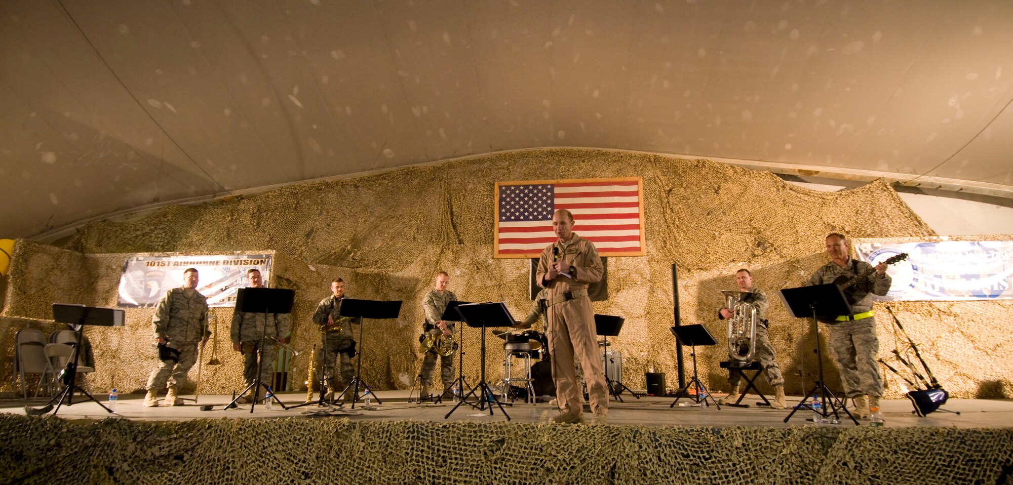 Brig. Gen. Mike Holmes, 455th Air Expeditionary Wing commander, introduces Air Forces Central band "Mojave" at their feature performance at Bagram Air Field, Afghanistan, Dec. 27. A guitar player himself, General Holmes thanked the band for coming out and entertaining the troops. (U.S. Air Force photo by Staff Sgt. Samuel Morse)(Released)