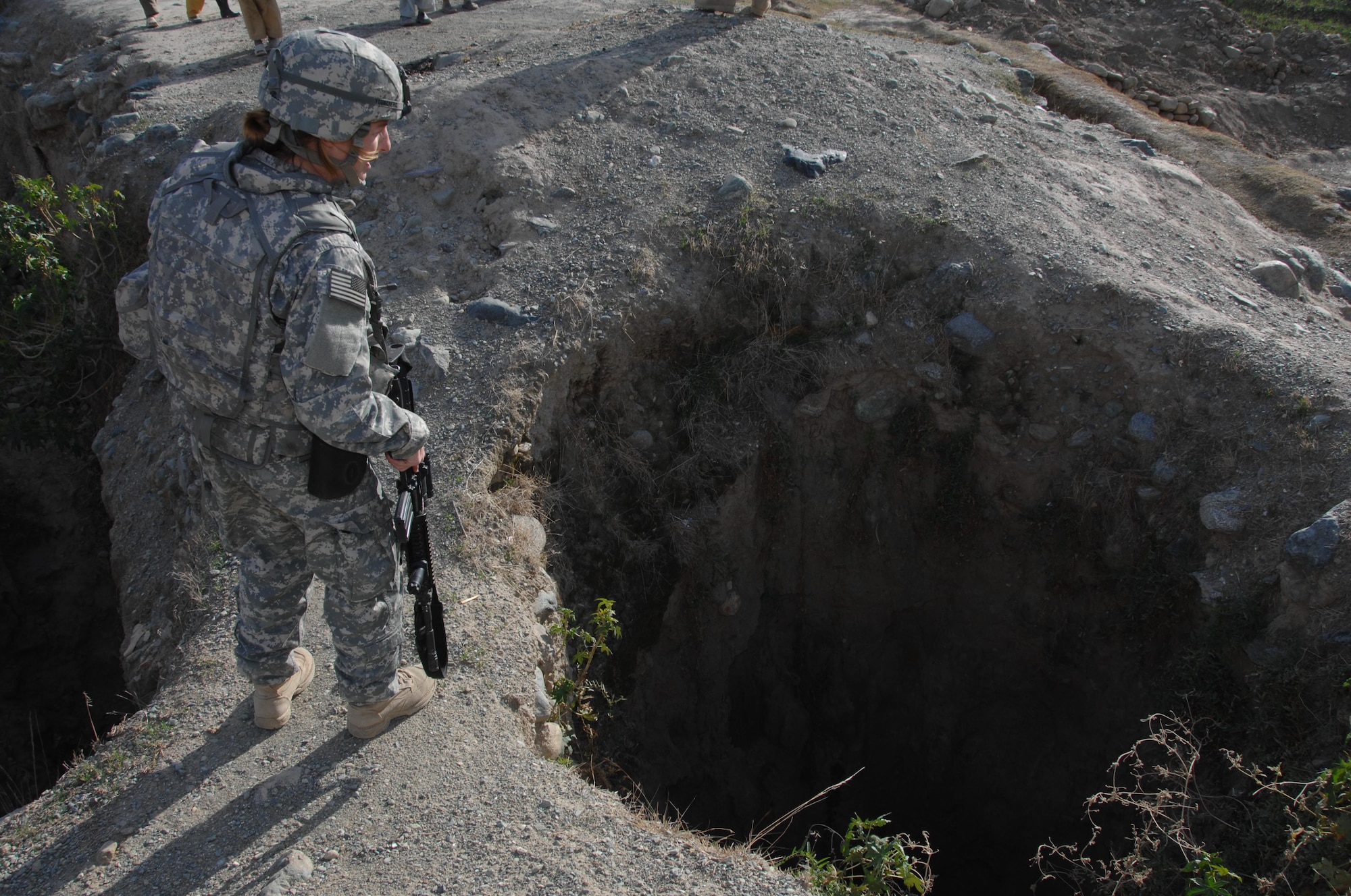 A member of the Konar Provincial Reconstruction Team looks at a well that needs some work in the district of Manawara, Konar province, Afghanistan, Dec. 14. (U.S. army photo by Spc. Russell Gilchrest)(Released)