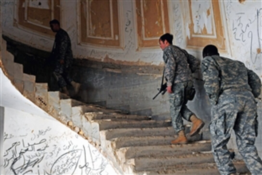 U.S. Army soldiers visit one of Saddam Hussein's old palaces in the Makhul Mountains in Bayji, Iraq, Dec. 22, 2008. The soldiers are assigned to Headquarters and Headquarters Company, 2nd Infantry Battalion, 27th Infantry Regiment, 3rd Brigade Combat Team, 25th Infantry Division.  