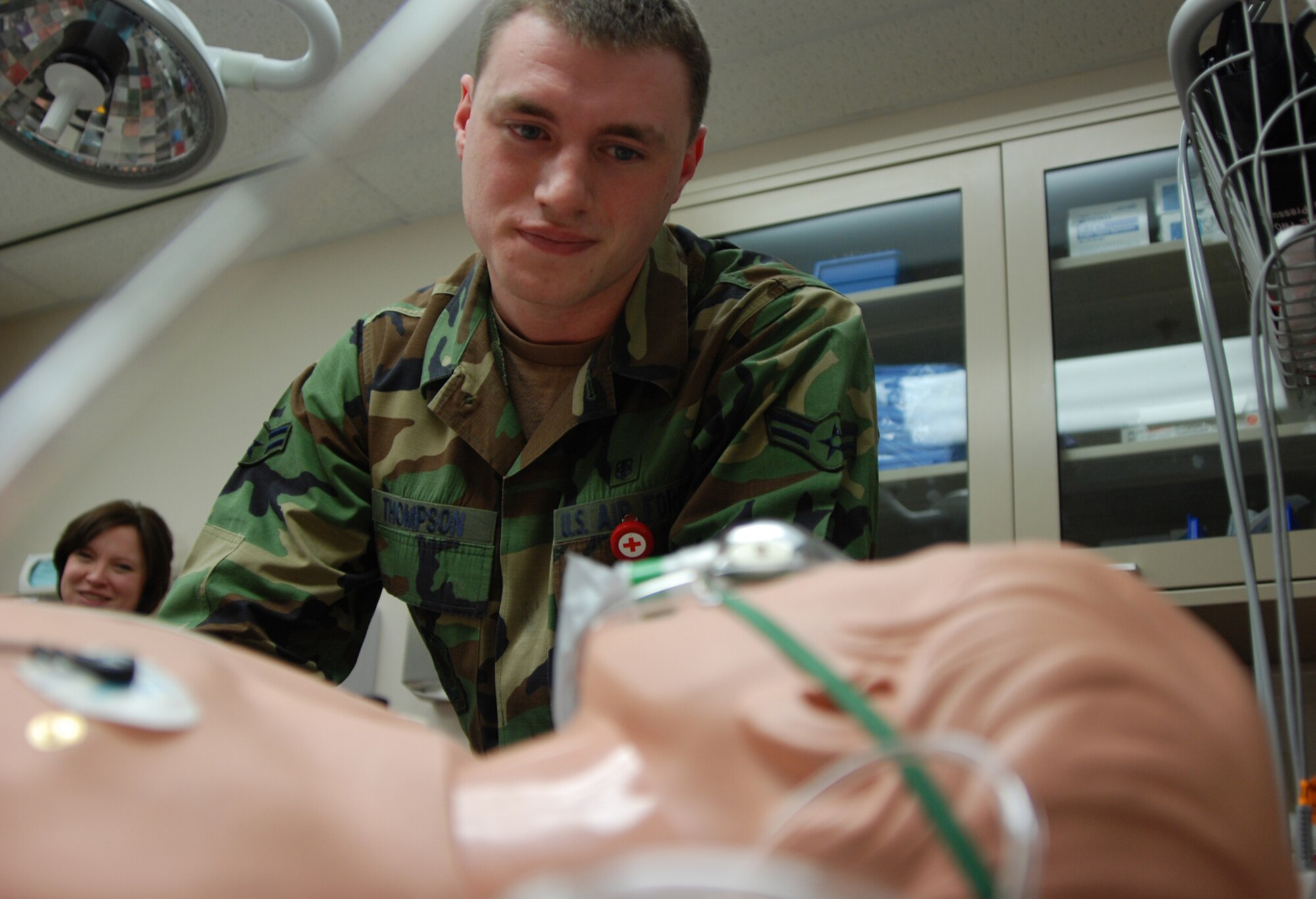 MCCONNELL AIR FORCE BASE, Kan. -- Airman 1st Class Greyson Thompson, 22nd Medical Operations Squadron, checks the vital signs on METI, a high-tech patient simulator Dec. 24 at the bases’ medical clinic. The dummy mimics life-like characteristics such as breathing, talking and bleeding to provide accurate and realistic training to medics. (Photo by Airman 1st Class Jessica Lockoski)