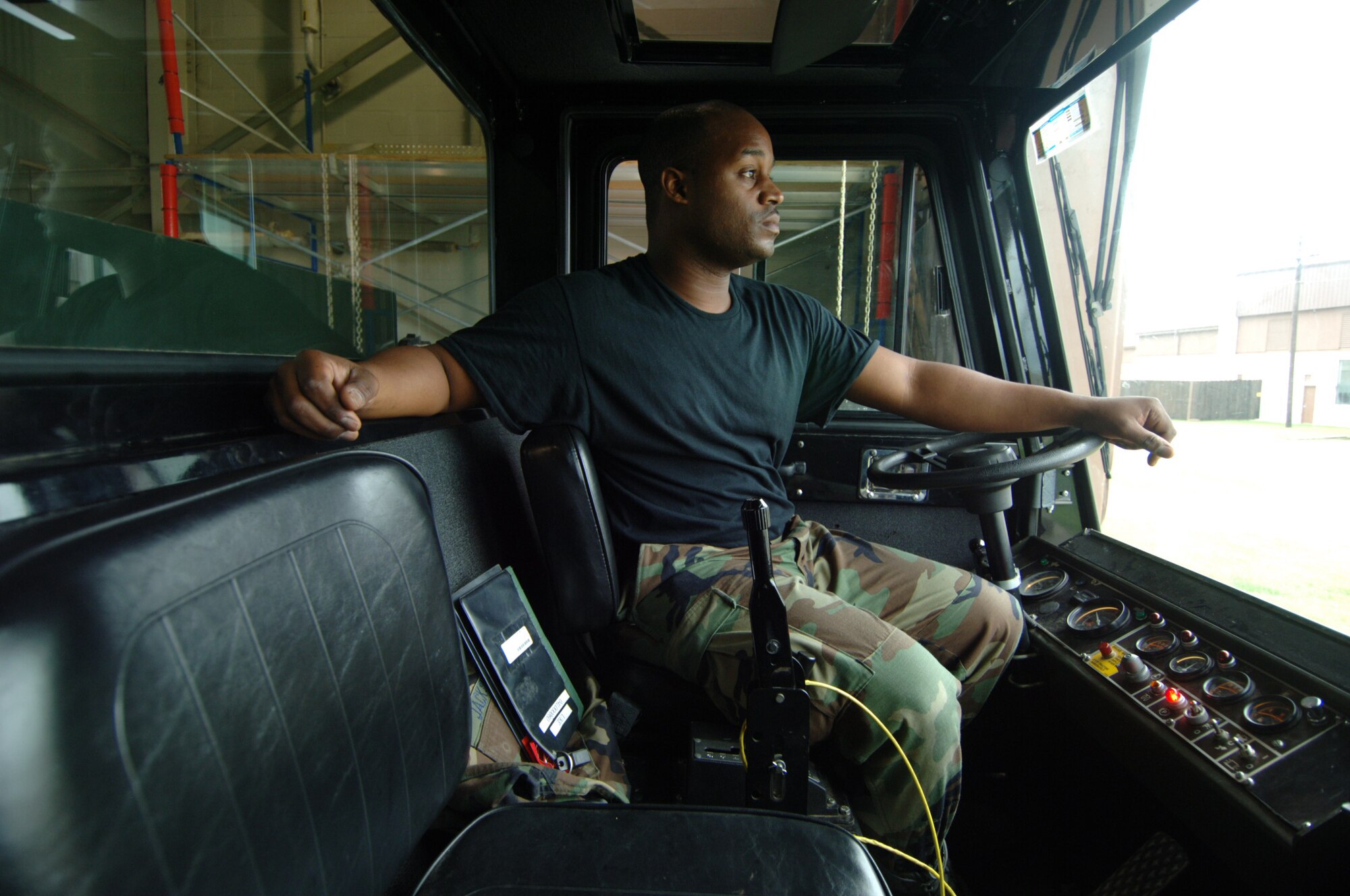 Tech. Sgt. Tylon Jackson looks through the windshield of a vehicle used to tow KC-135 Stratotankers at McConnell Air Force Base, Kan. Sergeant Jackson is a crew chief assigned to the 931st Aircraft Refueling Group's maintenance squadron at McConnell. Personnel increases within the maintenance squadron are expected to spur dramatic growth and change across the Group in 2009. The 931st Air Refueling Group is an Air Force Reserve unit at McConnell. Sergeant Jackson is a native of Tulsa, Okla. (U.S. Air Force photo/Tech. Sgt. Jason Schaap)  