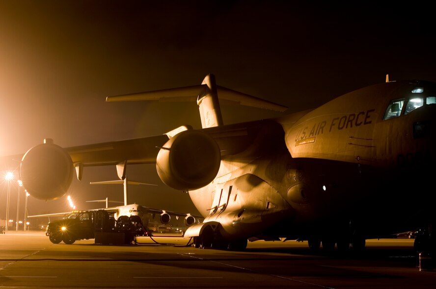 A McChord C-17 Globemaster III is refueled here Dec. 3 upon returning from a local mission. (U.S. Air Force photo/Abner Guzman)