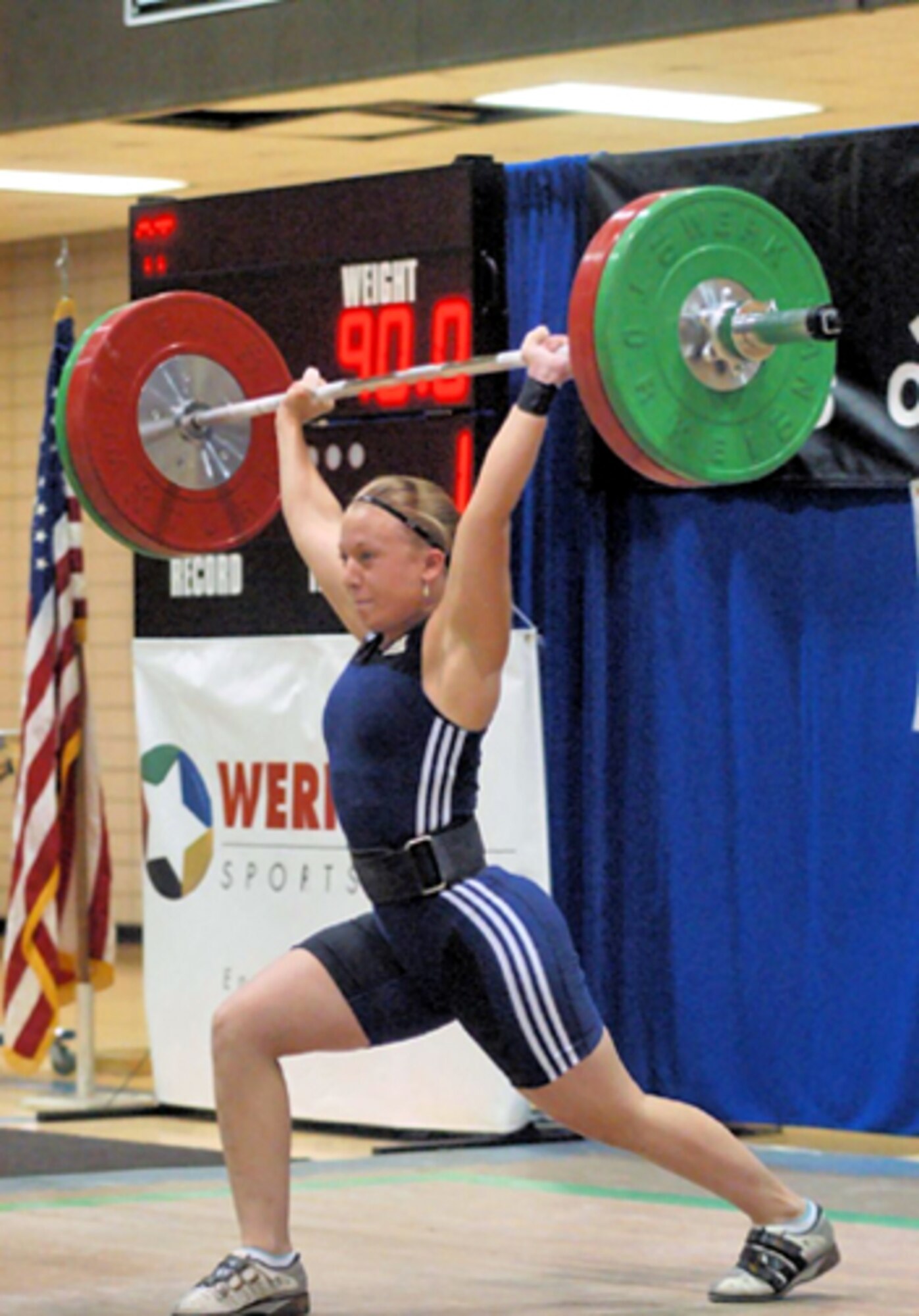Airman 1st Class Angela Candage, 305th Aerial Port Squadron, lifts 200 pounds in a jerk (overhead) maneuver during a senior national competition in 2006. Airman Candage is the No. 1 weightlifter in the U.S. in her weight category. In March, she will compete in the National Championships in Ohio. (Courtesy photo)