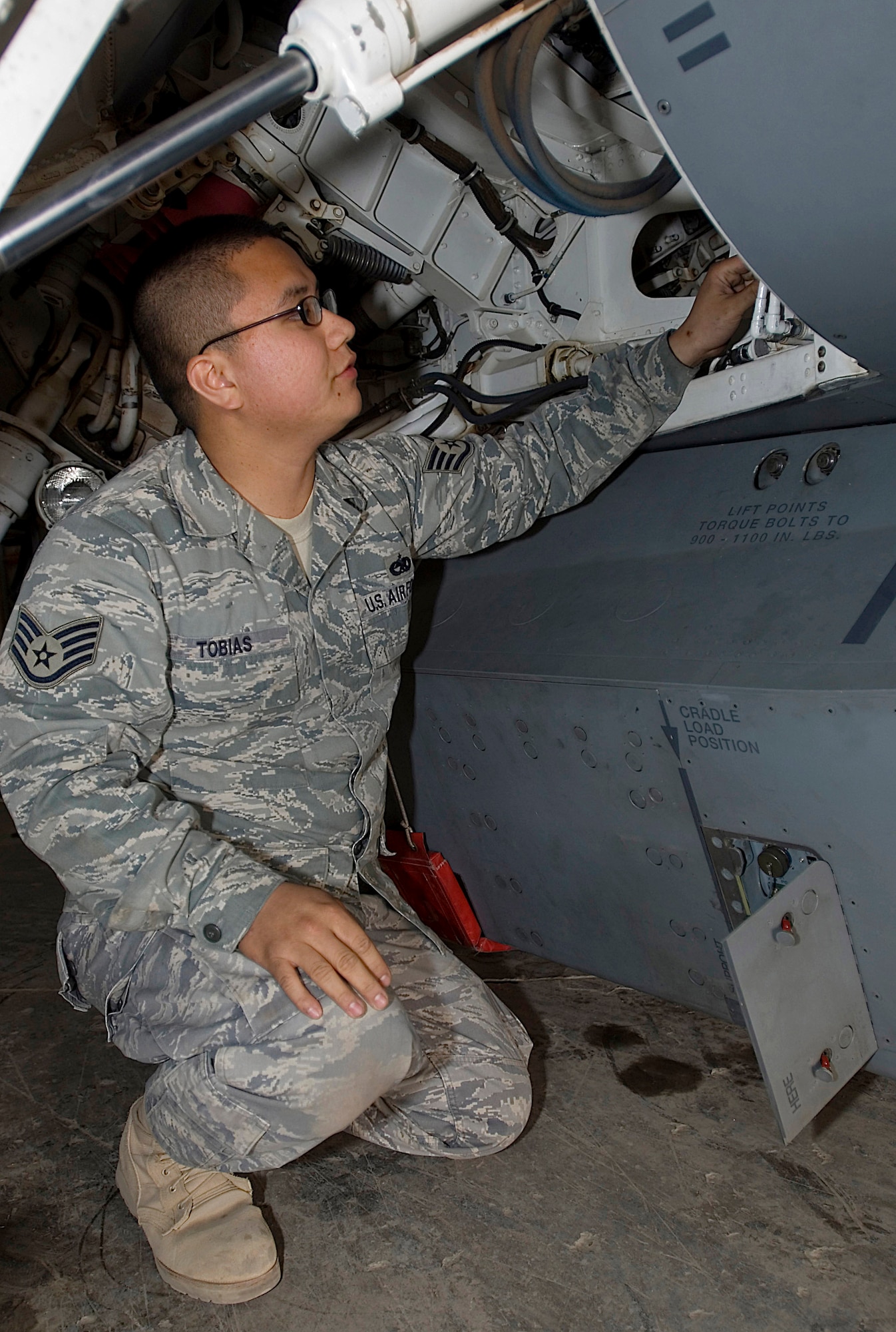 Staff Sgt. Christopher Tobias checks the forward directional antenna Dec. 21 on a Theater Airborne Reconnaissance System pod mounted on an F-16 Fighting Falcon at Joint Base Balad, Iraq. Ground commanders use TARS imagery to achieve their tactical objectives. Sergeant Tobias, one of four 332nd Expeditionary Aircraft Maintenance Squadron avionics maintainers responsible for the 332nd Expeditionary Fighter Squadron's TARS pods, is a native of Long Beach, Calif., and is deployed from Luke Air Force Base, Ariz. (U.S. Air Force Photo/Tech. Sgt. Erik Gudmundson)