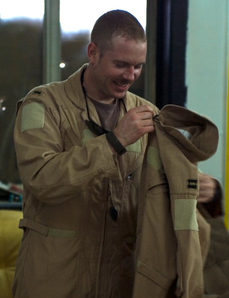 Capt. Kevin Danaher trades his lieutenant's bars for captain rank after a promotion ceremony over Iraq Dec. 25. Danaher, the standardization and evaluations liaison officer for the 14th Expeditionary Fighter Squadron at Joint Base Balad, Iraq, is deployed from Misawa Air Base, Japan. His hometown is Crystal River, Fla. (U.S. Air Force photo/Tech. Sgt. Erik Gudmundson)