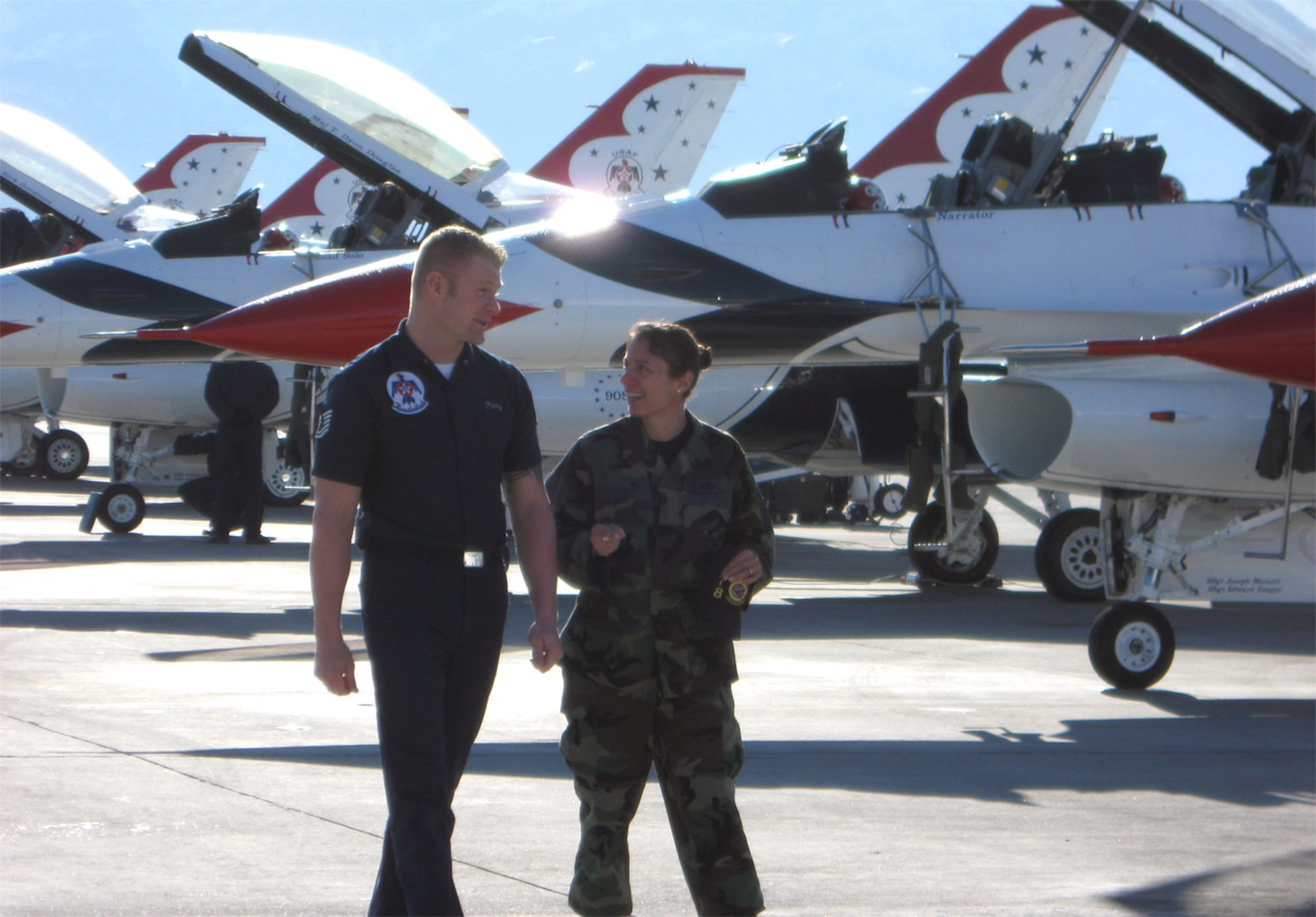 Tech. Sgt. Shanna Perry, F-22 Raptor dedicated crew chief, visits her husband, Tech. Sgt. Trent Perry, Quality Assurance Chief Inspector for the United States Air Force Air Demonstration Squadron, at the Thunderbirds jets. Sergeant Shanna Perry is a full-time reservist with the 926th Group while Sergeant Trent Perry is regular Air Force. The aircraft maintainers married after being reunited on the flightline at Nellis Air Force Base, Nev. 