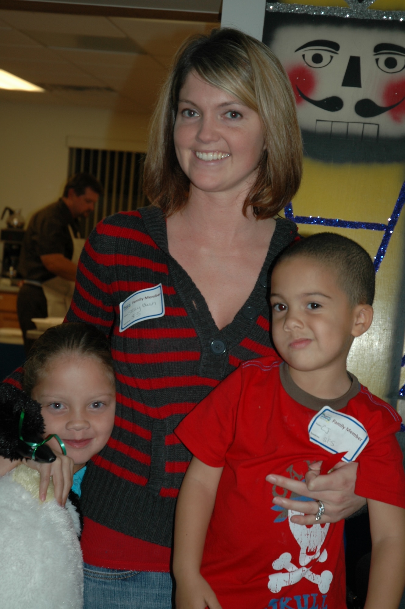 Enjoying activities hosted Dec. 16 by the Brevard County Civilian Military Community Relations Council held at the Airman & Family Readiness Center are Stacy Bush with her children Kiley and C.J. (U.S. Air Force photo by Chris Calkins)