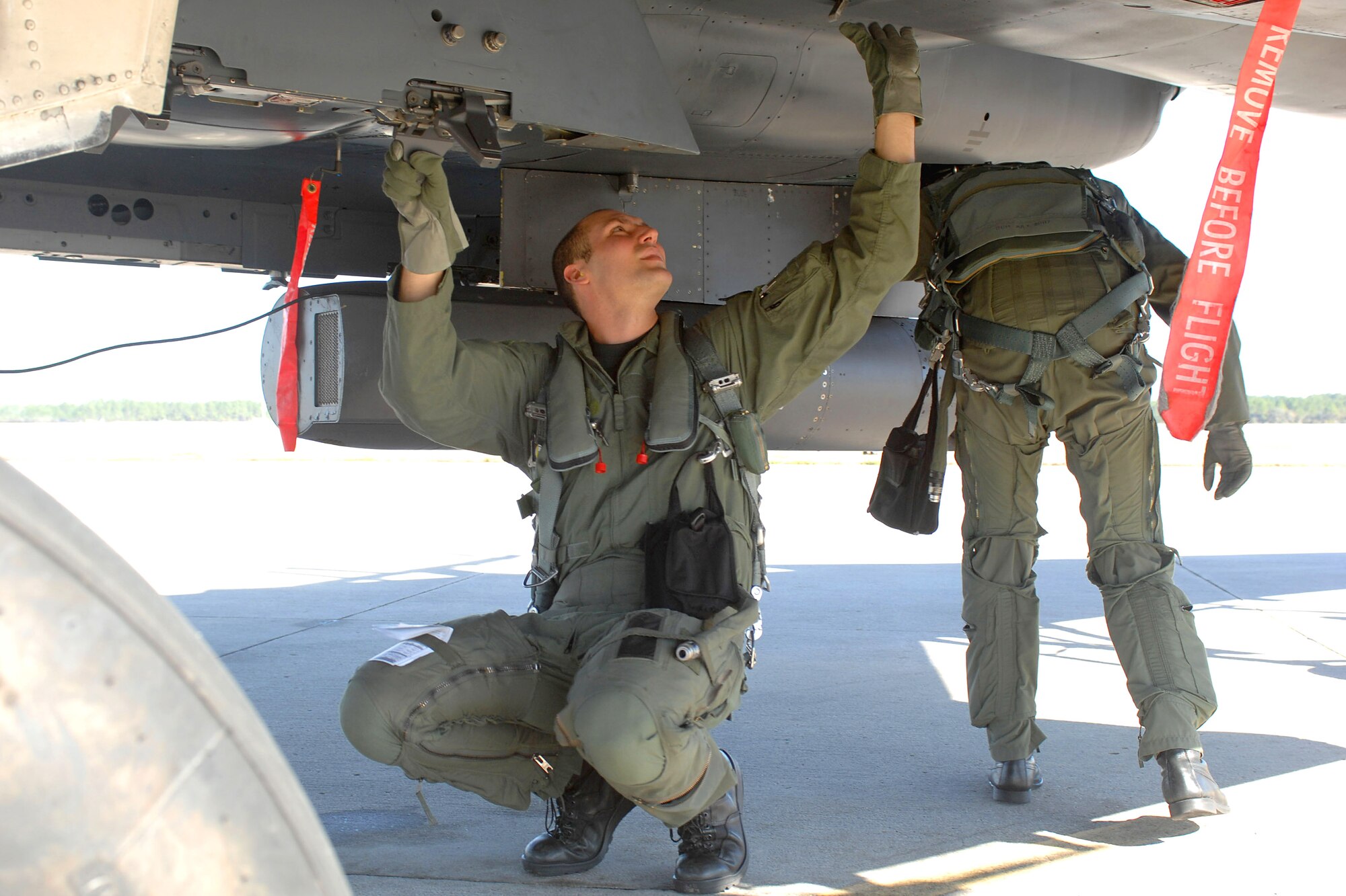 Capt. Thomas Zaremba, a 336th Fighter Squadron pilot, closes the gun door while inspecting an F-15E Strike Eagle prior to a training sortie at Tyndall Air Force Base, Fla., Dec. 18. The 336th FS and associated maintenance personnel completed the two-week air-to-air combat evaluation called Combat Archer Dec. 19. (U.S. Air Force photo by Staff Sgt. Shawn J. Jones)