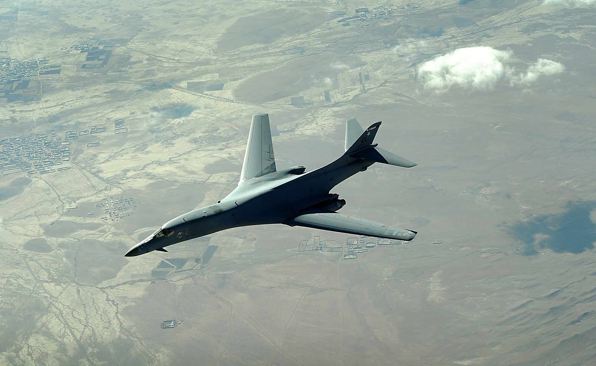 A B-1B Lancer flies a combat patrol mission over Afghanistan recently. The B-1B carries the largest payload of both guided and unguided weapons in the Air Force inventory and can rapidly delivery massive quantities of precision and non-precision weapons against any adversary. (U. S. Air Force photo/Staff Sgt. Aaron Allmon)   

