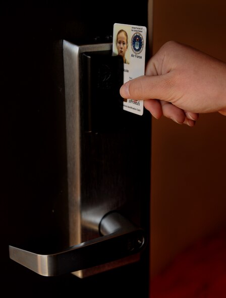 MOODY AIR FORCE BASE, Ga. -- Airman Brigitte Brantley, 23rd Wing Public Affairs journalist, uses her common access card to open her dorm room Dec. 22 here. The base has recently installed keyless locks to provide Airmen with more security and track who has accessed the room. (U.S. Air Force photo by Senior Airman Gina Chiaverotti) 