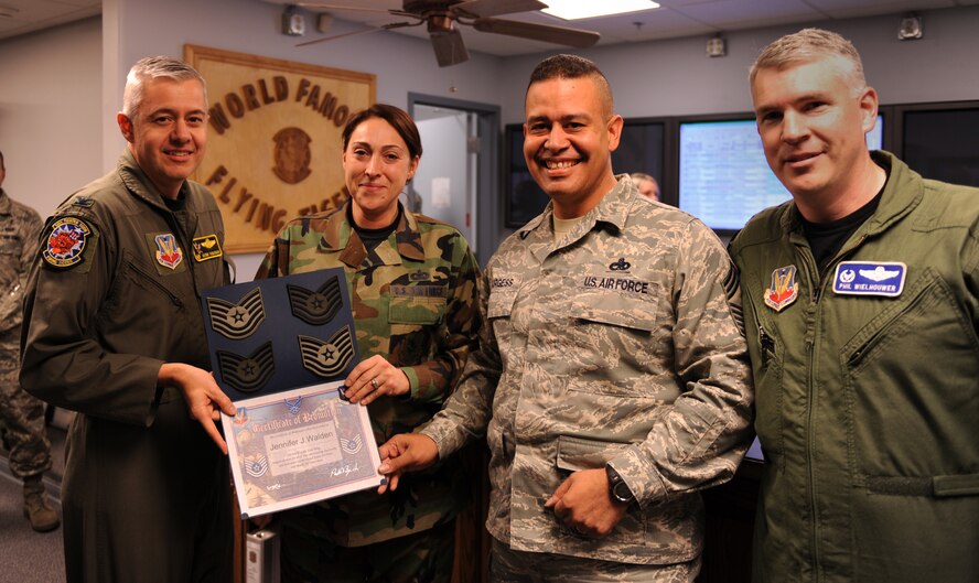 MOODY AIR FORCE BASE, Ga. – Staff Sgt. Jennifer Walden, 74th Fighter Squadron, poses for a photo with Col. Kenneth Todorov, 23rd Wing commander, Chief Master Sgt. Paul Burgess, 23rd Wing command chief, and Lt. Col. Philip Wielhouwer, 74th Fighter Squadron commander, after being promoted to technical sergeant here Dec. 29. Sergeant Walden was promoted under the Stripes for Exceptional Performers program. (U.S. Air Force photo by Airman Joshua Green) 