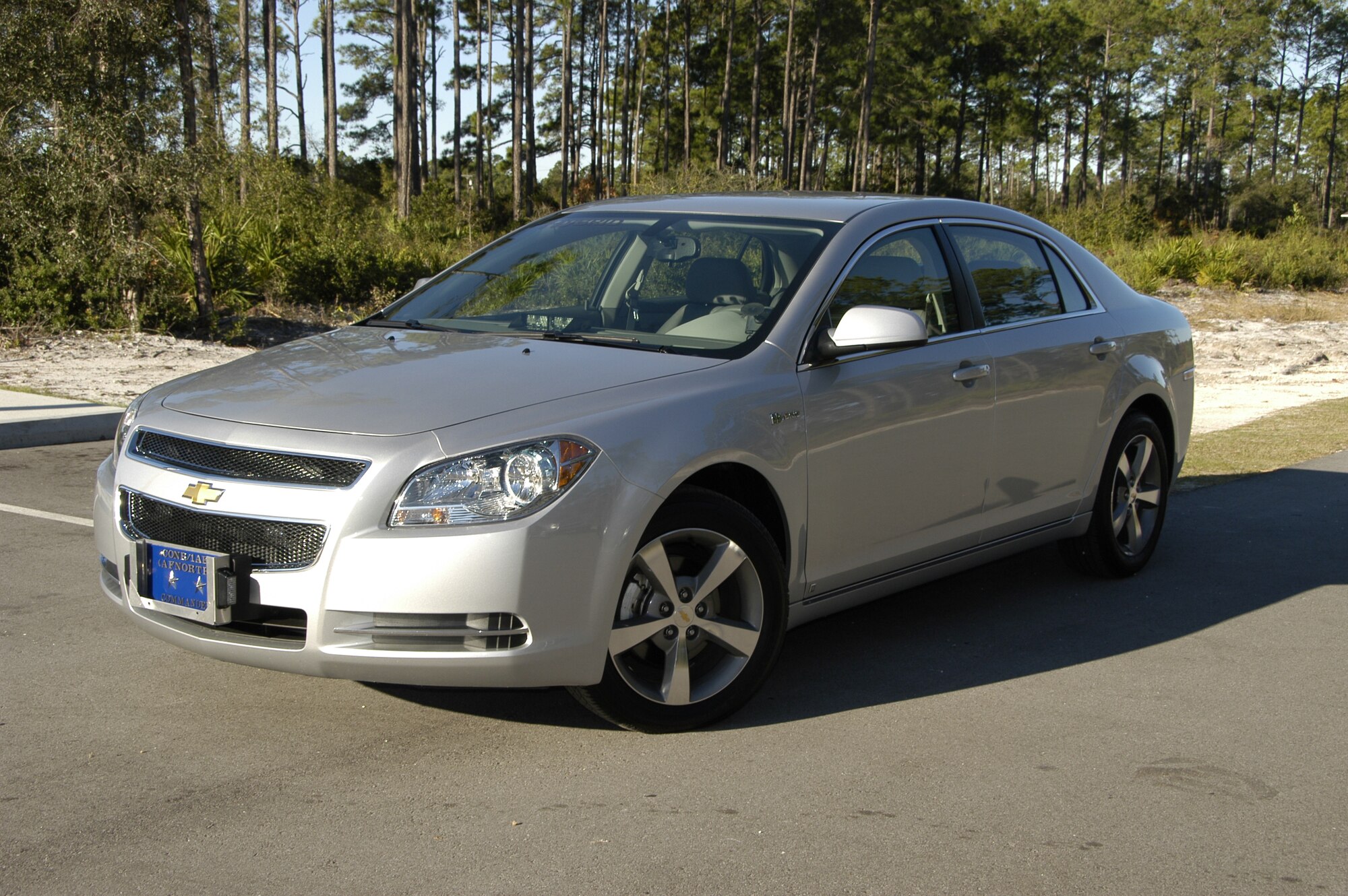 Maj. Gen. Hank Morrow, CONR/1AF Commander, 'Goes Green' with its his new hybrid vehicle. A 2009 Chevy Malibu.
