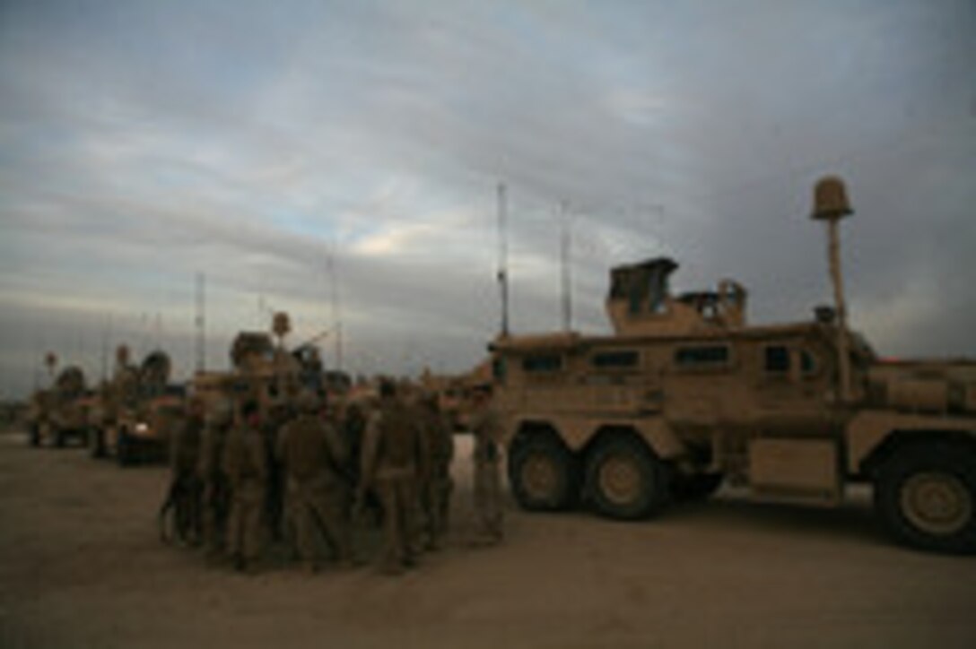 CAMP BAHARIA, Iraq (Dec. 30, 2008) – The Marines of first squad, Security Company, Combat Logistics Battalion 5, 1st Marine Logistics Group, review procedures before a combat logistics patrol Dec. 30. The Marines in Security Co. provide route security for convoys. Their defensive tactics keep the other vehicles out of harm’s way and ensure a safe trip to their destination. They protect the convoy and are responsible for setting up landing zones in case a casualty needs to be evacuated. (Photo by Cpl. Tyler B. Barstow)