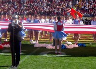 Cpl. Jessica Bishop, Marine Corps Recruiting Command, sings the National Anthem before the Outback Bowl Jan. 1 at Raymond James Stadium in Tampa, Fl. Marines from the Global War on Terror,  local recruiting stations and alumni of the repsentative schools were honored at halftime of the game that featured the universities of Iowa and South Carolina.