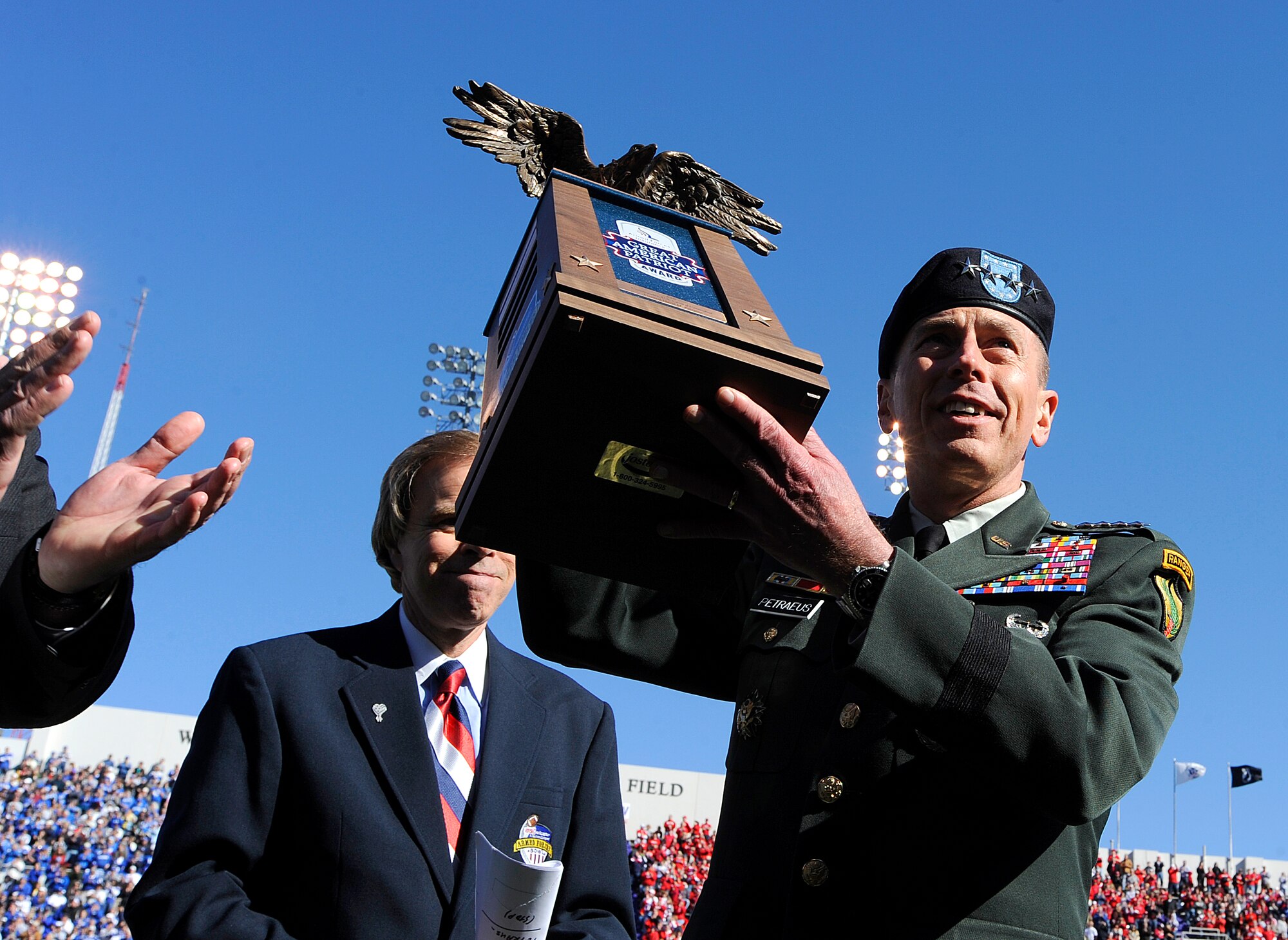 Gen. David Petraeus, U.S. Central Command commander, is honored with the Armed Forces Insurance Great American Patriot Award during half time of the Bell Helicopter Armed Forces Bowl game between the U.S. Air Force Academy and the University of Houston, Dec. 31 at Amon G. Carter Stadium in Fort Worth, Texas. (U.S. Air Force photo/Staff Sgt. Bennie J. Davis III)