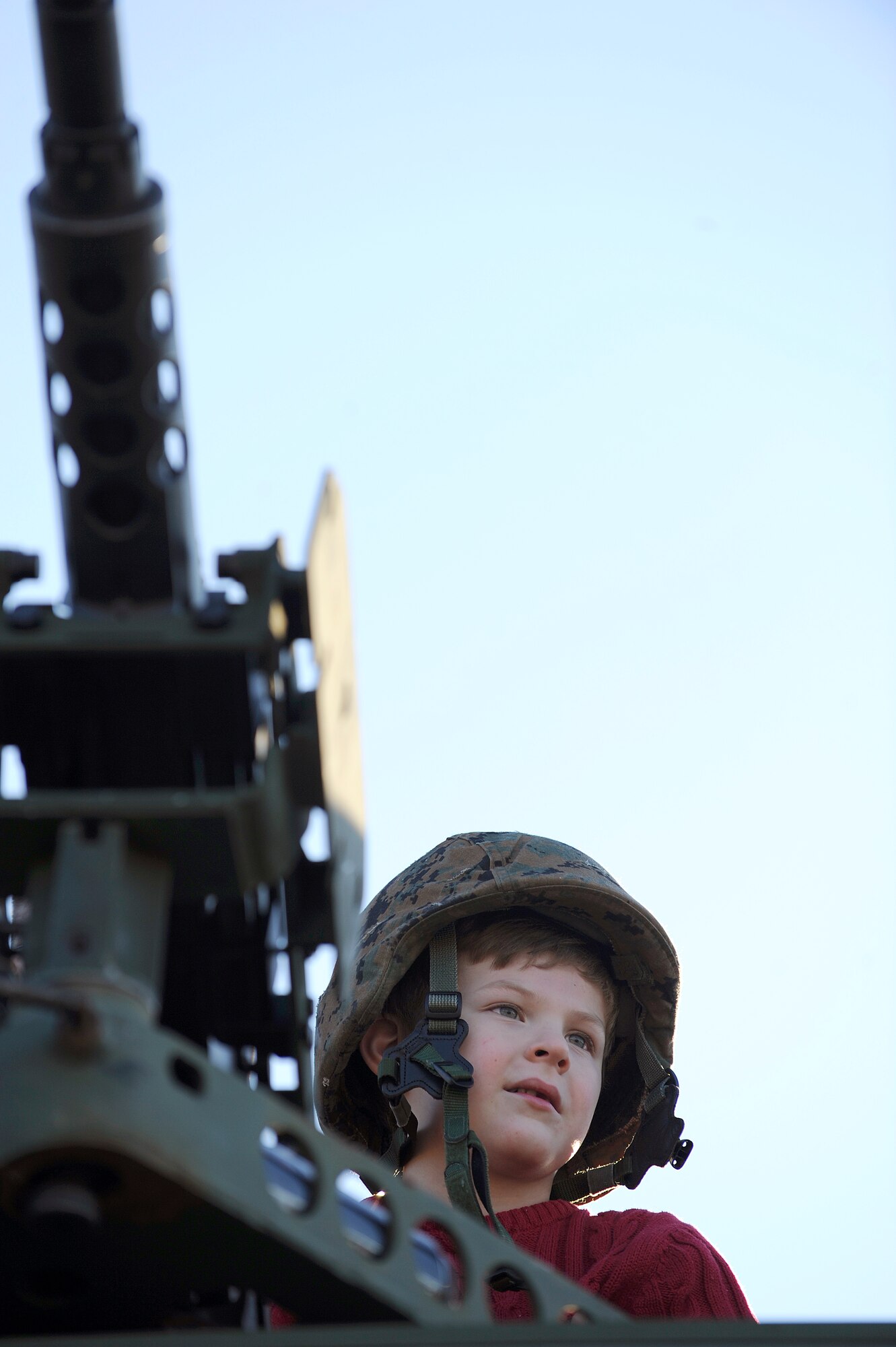 Jonathan Hardy, 6, sits atop an armored personnel vehicle at an U.S. Army exhibit during the Adventure Day celebration and pep rally Dec. 30 for the Bell Helicopter Armed Forces Bowl game between the U.S. Air Force Academy and the University of Houston at Amon G. Carter Stadium in Fort Worth, Texas.  (U.S. Air Force photo/Staff Sgt. Bennie J. Davis III)