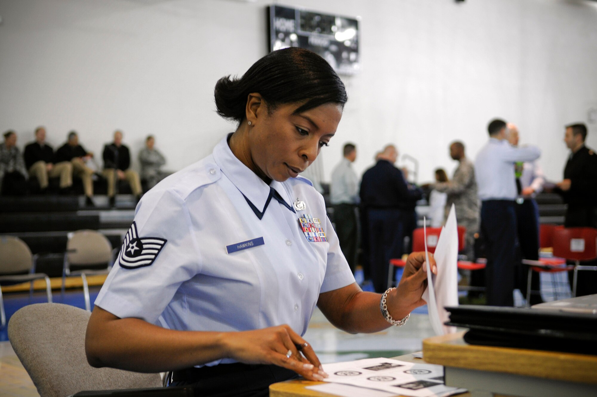 Tech. Sgt. Marica Hawkins prepares for a large scale map exercise Nov 6 at Fort Lesley J. McNair, Washington, D.C. The map exercise will designate all participant locations for the 56th Inaugural Day period in January 2009. Sergeant Hawkins is a Armed Forces Inaugural Committee member. (Department of Defense photo/Tech. Sgt. Suzanne Day)

