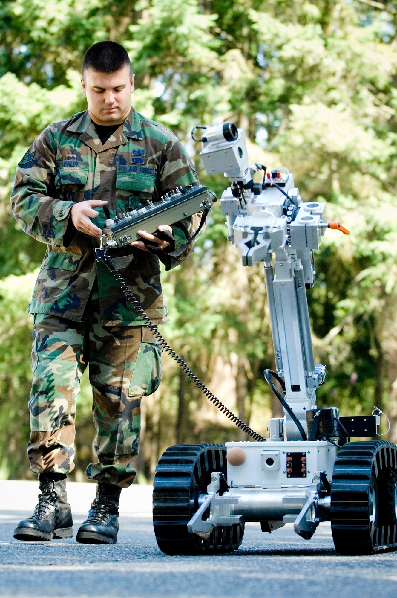 Senior Airman Jace Kennedy, an Air Force Reserve explosives ordnance disposal specialist, runs a EOD robot through its paces.  Airman Kennedy is one of more than, 2,400 Citizen Airmen in the 446th Airlift Wing, McChord Air Force Base, Wash., serving our nation. (U.S. Air Force photo/Abner Guzman)