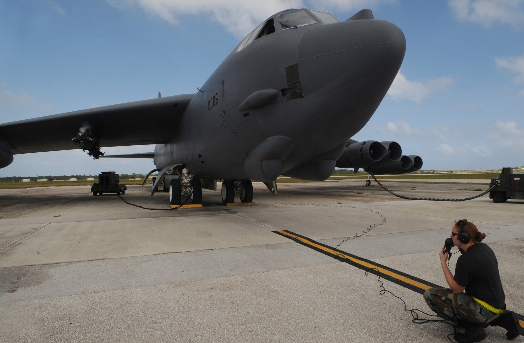 Airman 1st Class Caroline Kraus performs preflight checks during a B-52 Stratofortress launch Dec. 30 at Andersen Air Force Base, Guam. Airman Kraus is assigned to the 36th Expeditionary Aircraft Maintenance Squadron at Andersen and is deployed from Minot AFB, N.D. The bomber's participation in constant training helps emphasize the U.S. bomber presence, demonstrating U.S. commitment to the Pacific region. (U.S. Air Force photo/Master Sgt. Kevin J. Gruenwald)