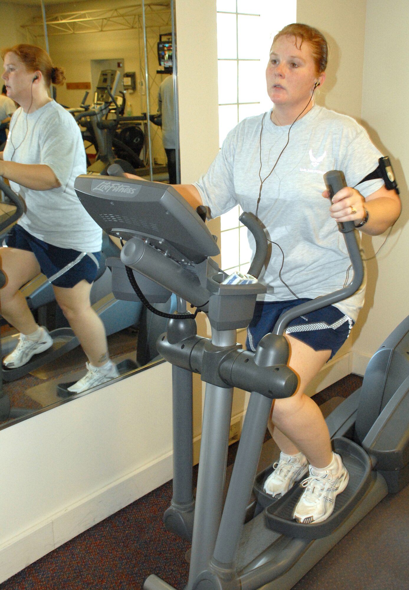 DOVER AIR FORCE BASE, Del. ? Tech. Sgt. Joanne Burgess, 436th Airlift Wing, works toward her New Year?s resolution on the elliptical machine at the Fitness Center. ?I am going to study hard for promotions and lose weight,? said Sergeant Burgess. (U.S. Air Force photo/ Airman 1st Class Shen-Chia Chu)