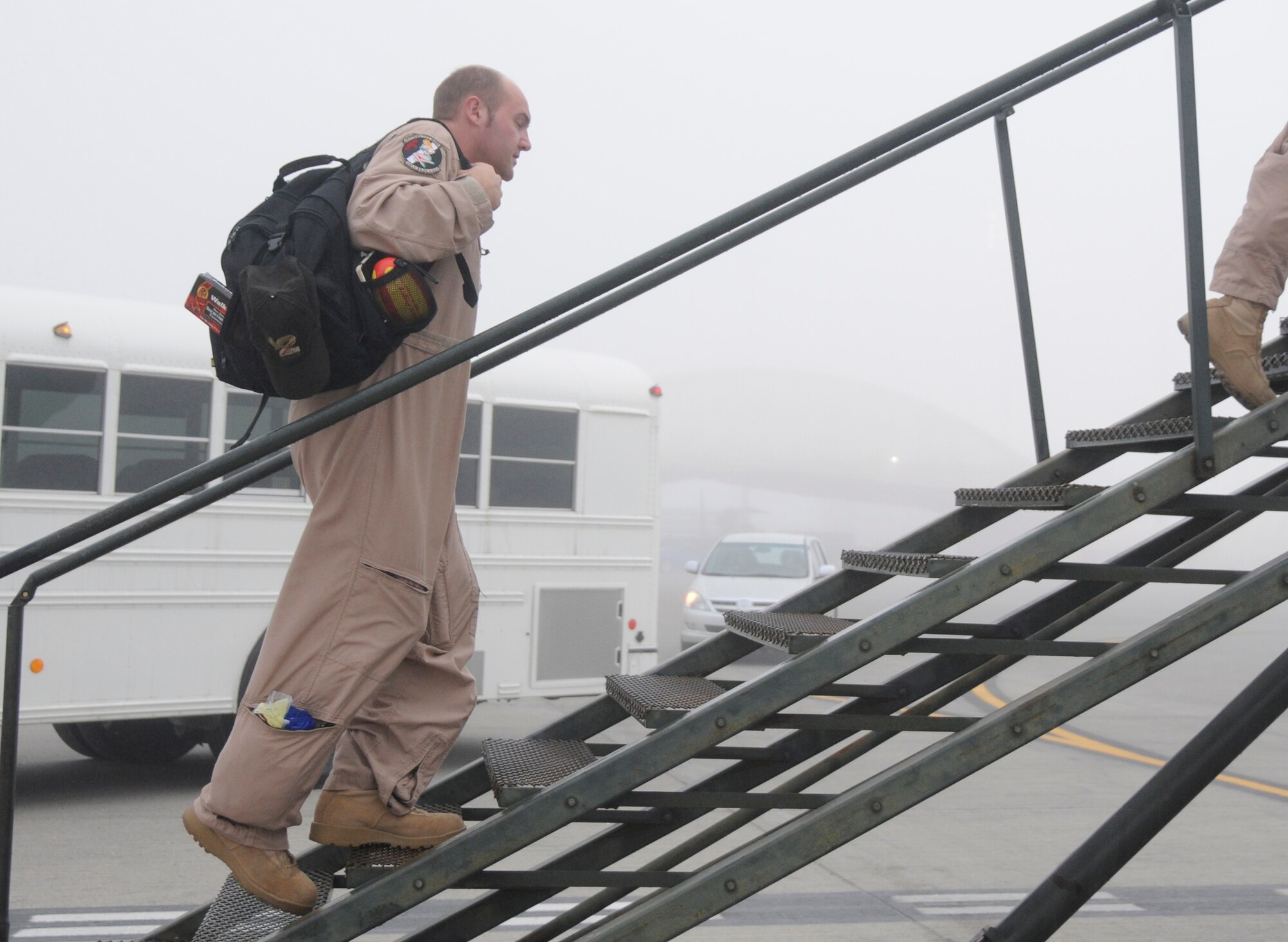 SOUTHWEST ASIA -- Flight Lt. Nathan Yabsley with the 965th Expeditionary Airborne Air Control Squadron prepares to board an E-3 Sentry here Dec. 24. He was preparing to fly his final mission at the 380th Air Expeditionary Wing before headaing home to Australia. He has been with the 965th out of Tinker Air Force Base, Okla. for three years with the last four months in a deployed location gaining valuable frontline experience. While deployed with the 965th Flight Lieutenant Yablsey has flown 20 missions in the area of responsibility in support of Operations Iraqi and Enduring Freedom. (U.S. Air Force photo/Tech. Sgt. Christopher A. Campbell)(released)