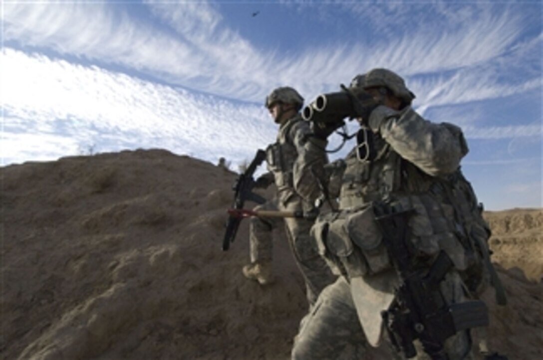 U.S. Army soldiers of 3rd Battalion, 21st Infantry Regiment, 1st Stryker Brigade Combat Team, 25th Infantry Division scan for suspicious activity during a patrol of the Diyala River Valley in Iraq on Dec. 27, 2008.  