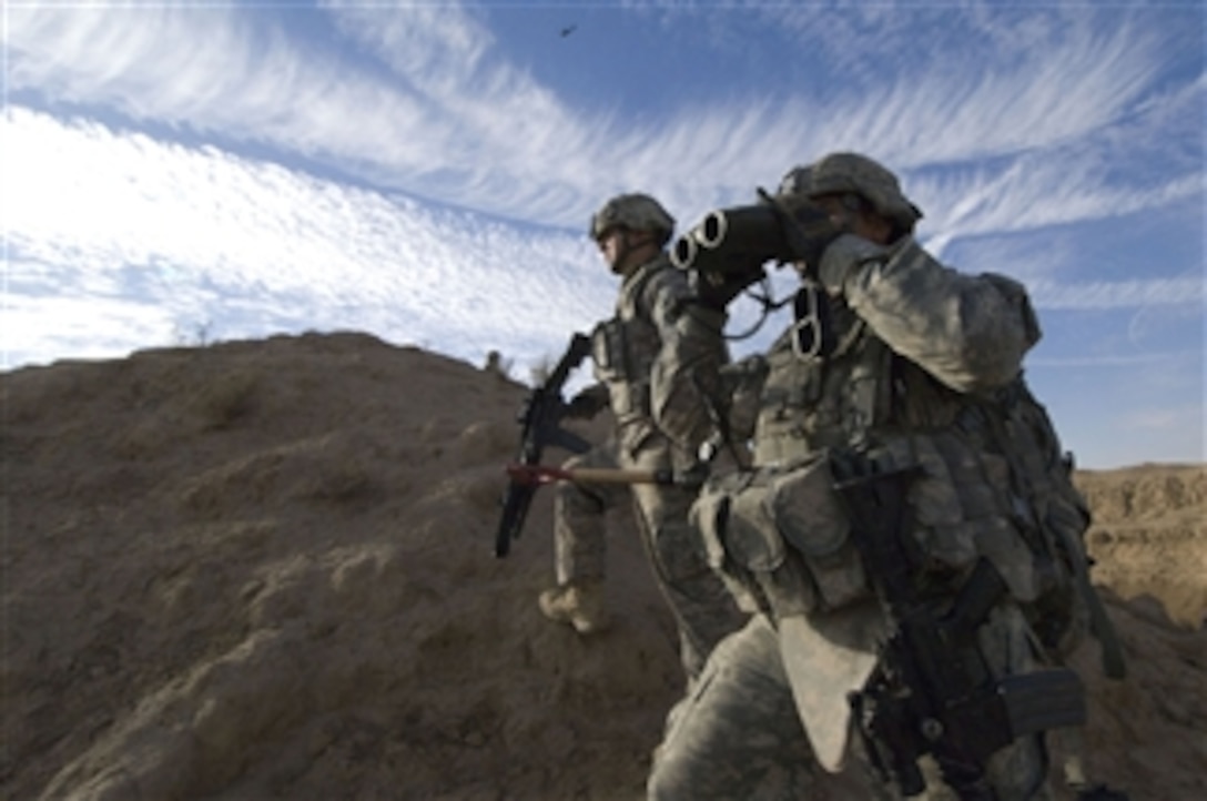 U.S. Army soldiers of 3rd Battalion, 21st Infantry Regiment, 1st Stryker Brigade Combat Team, 25th Infantry Division scan for suspicious activity during a patrol of the Diyala River Valley in Iraq on Dec. 27, 2008.  