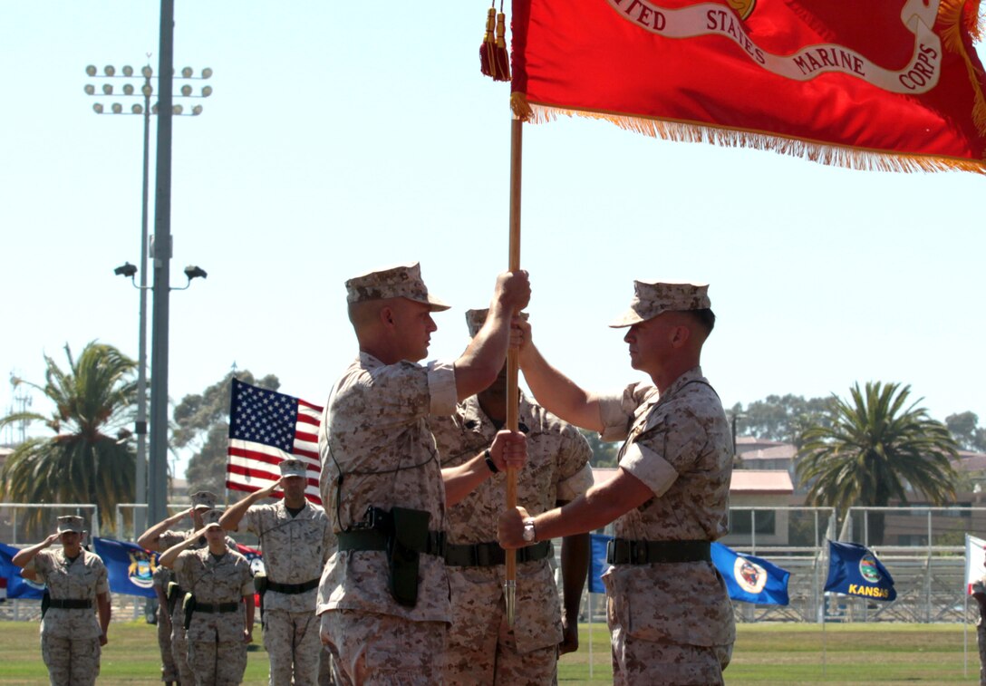 Col. James A. Hogberg (left), takes command of Headquarters and Support Battalion, Marine Corps Base Camp Pendleton, from Col. Philippe D. Rogers, July 1. Before taking over command for Headquarters and Support Battalion, Hogberg transferred to I Marine Expeditionary Force in 2009 where he served as the Comptroller. Hogberg was also assigned as the Director of Logistics Movement Coordination Center for Reconstruction Logistics when deployed to Iraq in 2006 in Baghdad, and the officer in charge of the Iraq Reconstruction Warehousing Facility in Abu Graib.