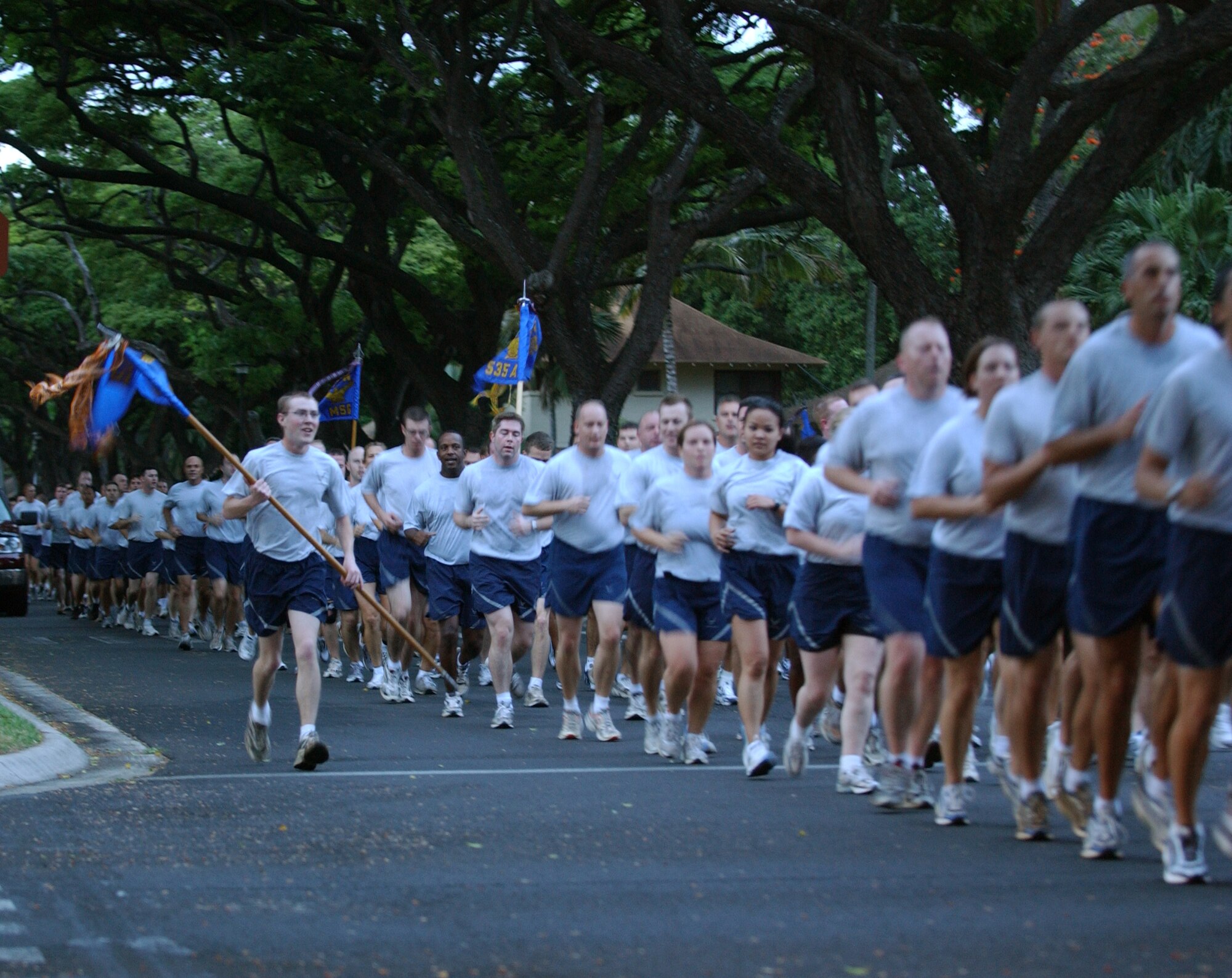 Hickam Airmen push through the half-way point of the Warrior Run. The 3-mile run is designed to boost camaraderie among base units. About 1,000 participants, inclucing Army and Navy members, normally participate in the run. Photo by Master Sgt. Robert Burgess