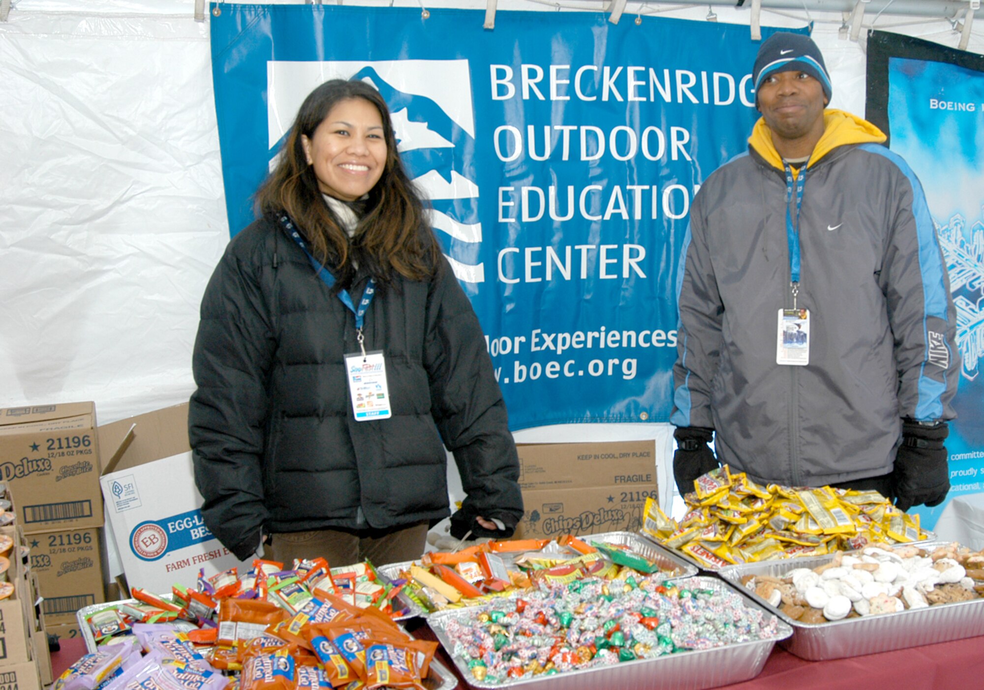 Maj. Veronica Anteola, 90th Force Support Squadron, and 1st Lt. Derick Price, 90th FSS, take a break just before the SnoFest Hospitality Tent opens for business Jan. 25 (U.S. Air Force photo/Todd Ryan).