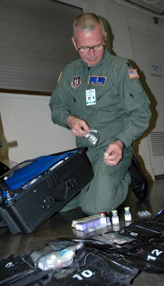 Lt. Col. Eric Johnson inventories the drug kit to make sure the Critical Care Air Transport Team has every medicine they will need during flights for the Pacific Lifeline exercise. Pacific Lifeline is a humanitarian assistance disaster response exercise taking place over three Hawaiian Islands Jan. 26 to Feb. 9. More than 900 Department of Defense personnel are participating. Colonel Johnson is an anesthesiologist for the 446th Aeromedical Staging Squadron. (U.S. Air Force photo/Capt. Jennifer Gerhardt)