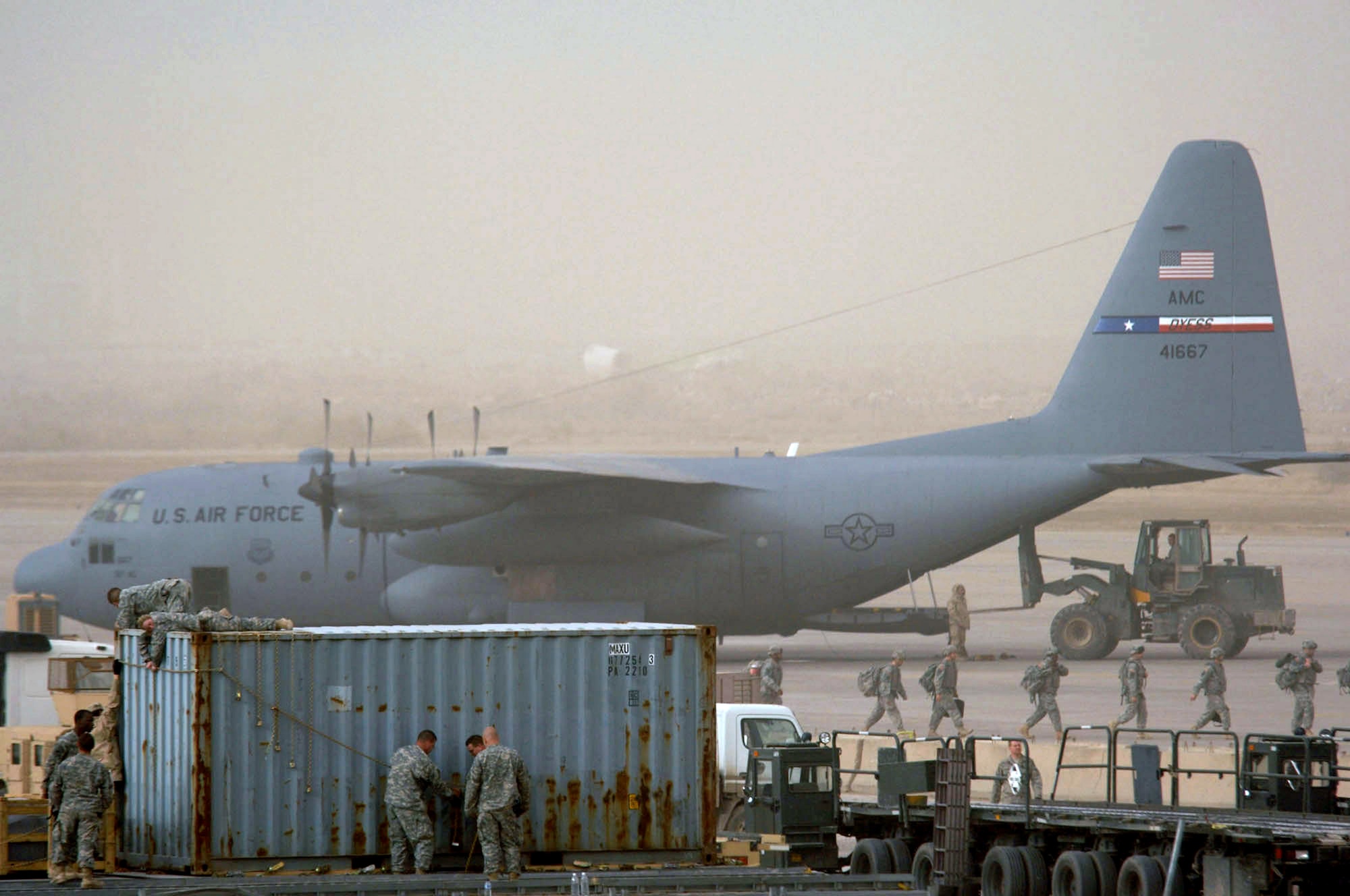 Airfield operations continue despite a dust storm Jan. 30 at Sather Air Base, Iraq. Sather AB is located on the west side of Baghdad International Airport and base Airmen move 6,200 passengers weekly and more than 1,700 tons of cargo weekly.  (U.S. Air Force photo/Tech. Sgt. Jeffrey Allen) 
